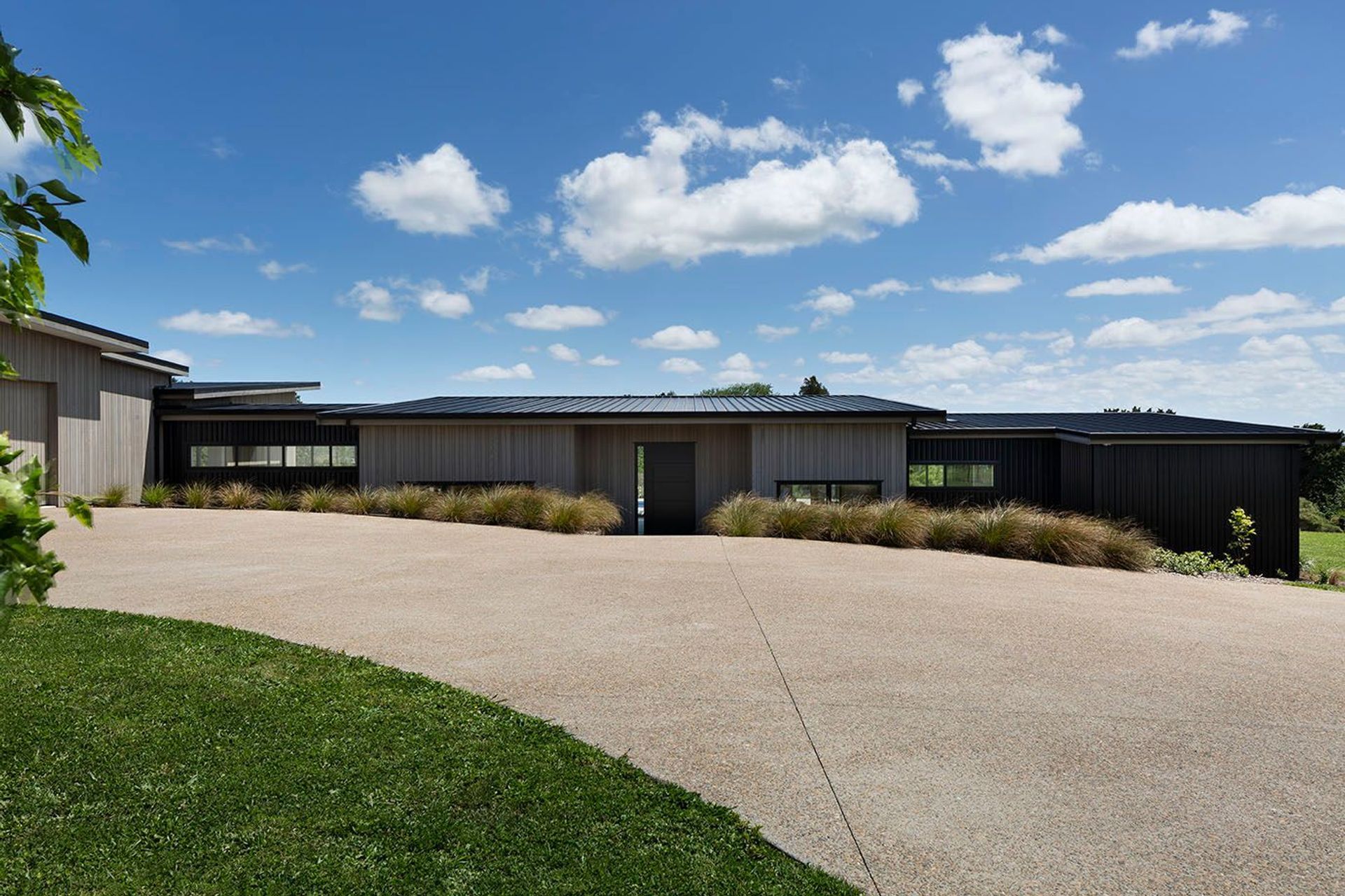 Nestled into the landscape following the lines of the property