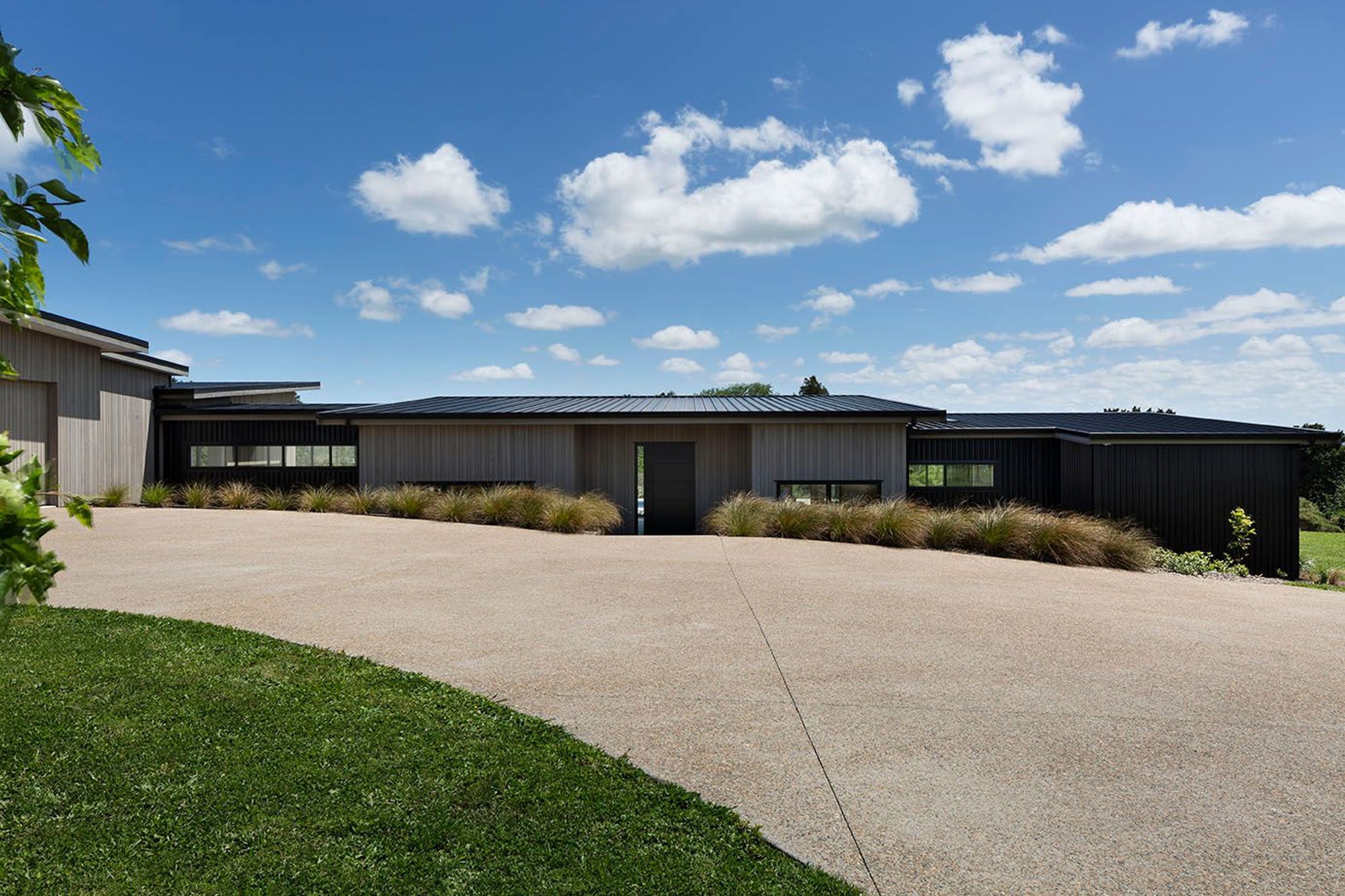 Nestled into the landscape following the lines of the property