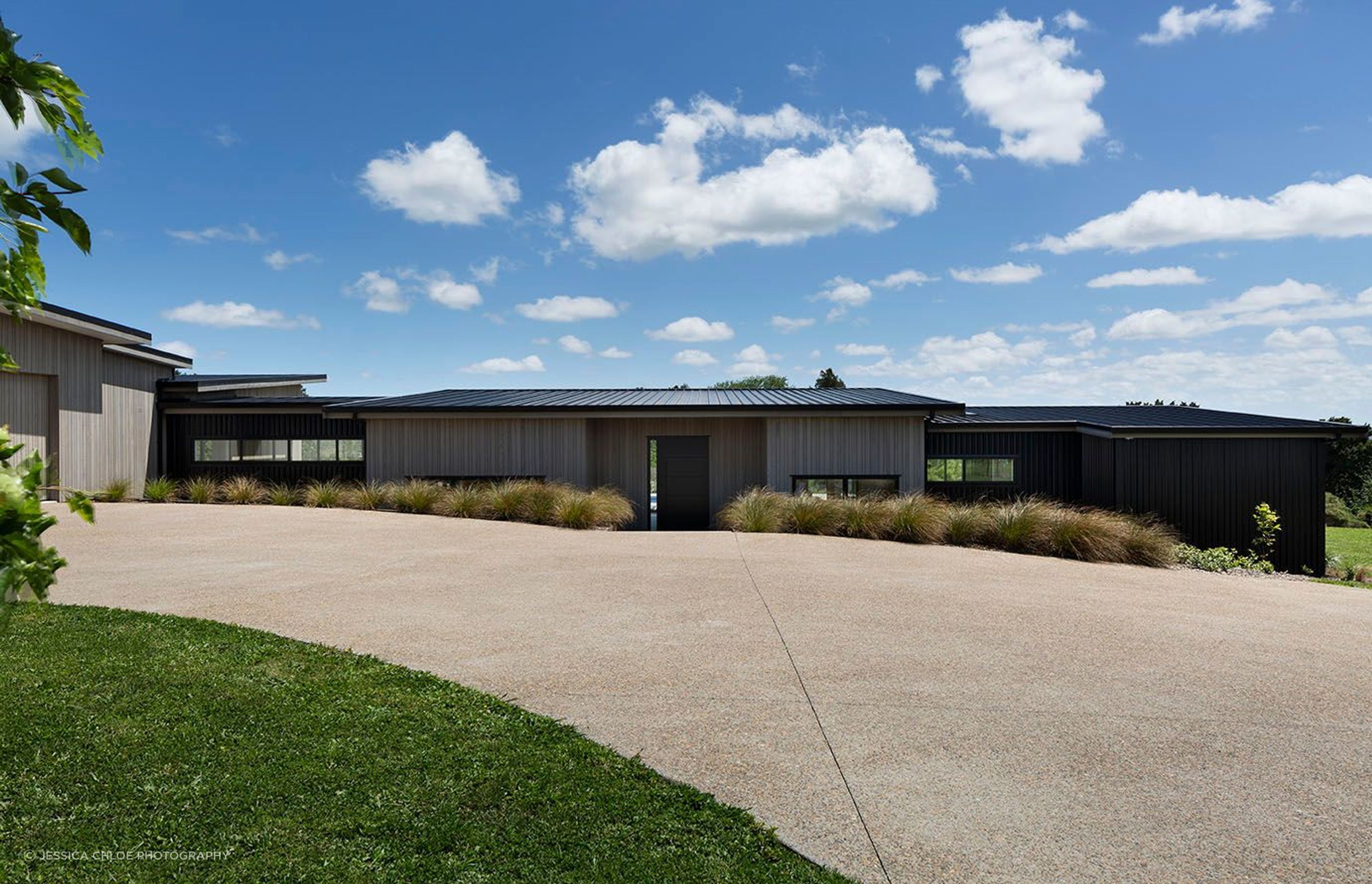 Nestled into the landscape following the lines of the property