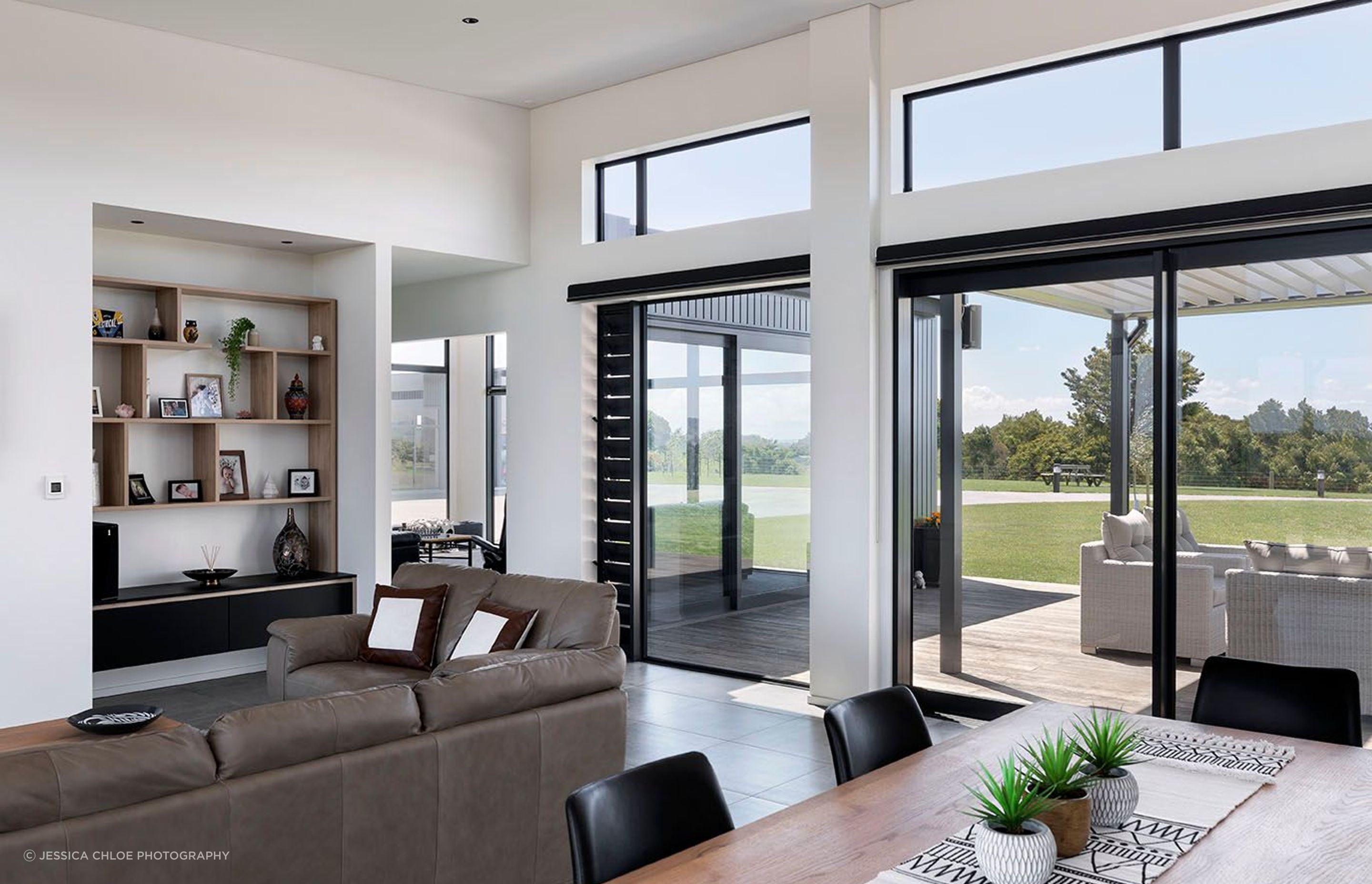 Larger open plan living spaces flow through to a more private quiet sitting room that helps frame the external sitting spaces