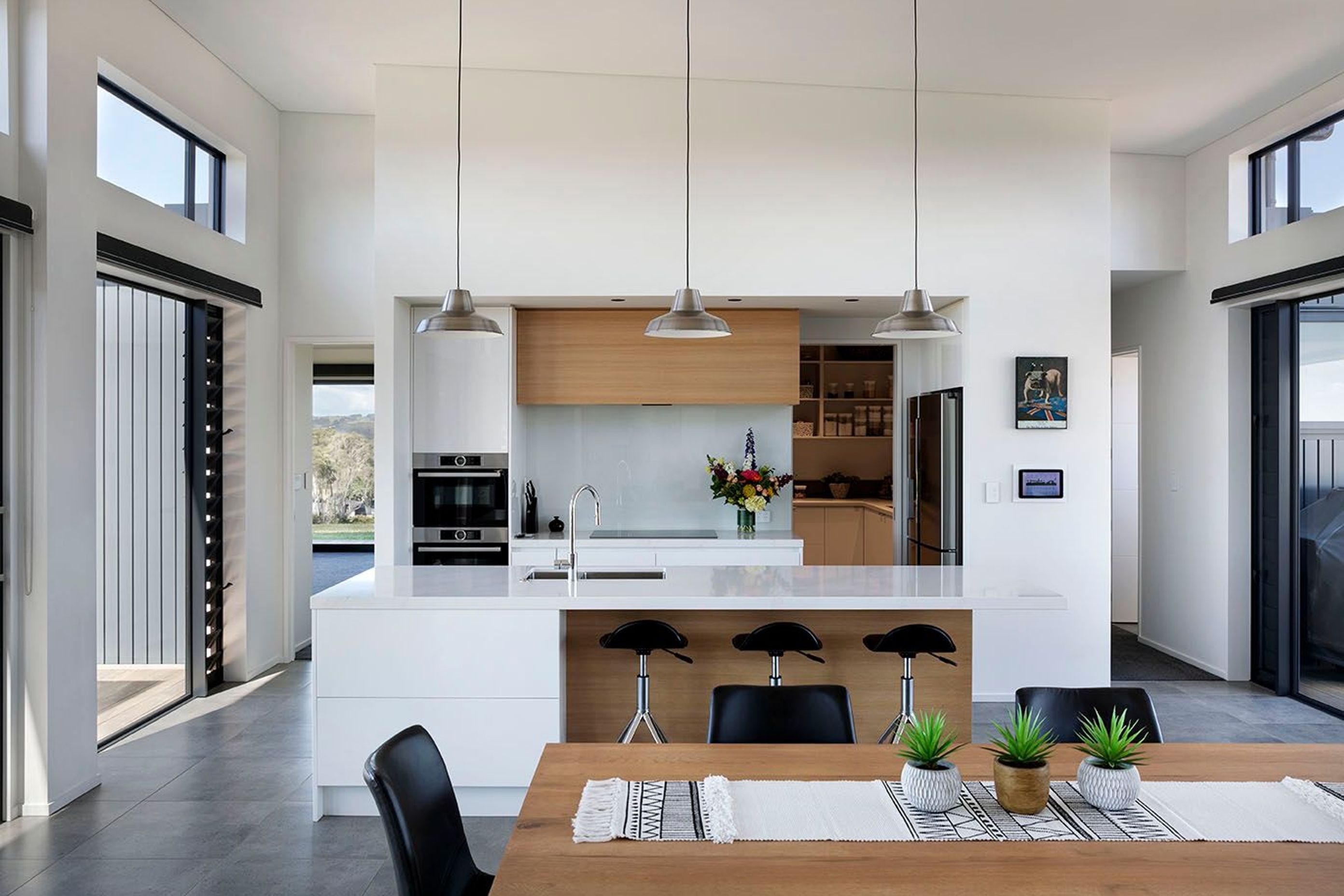 Kitchen allows open plan living and flow to the living spaces
