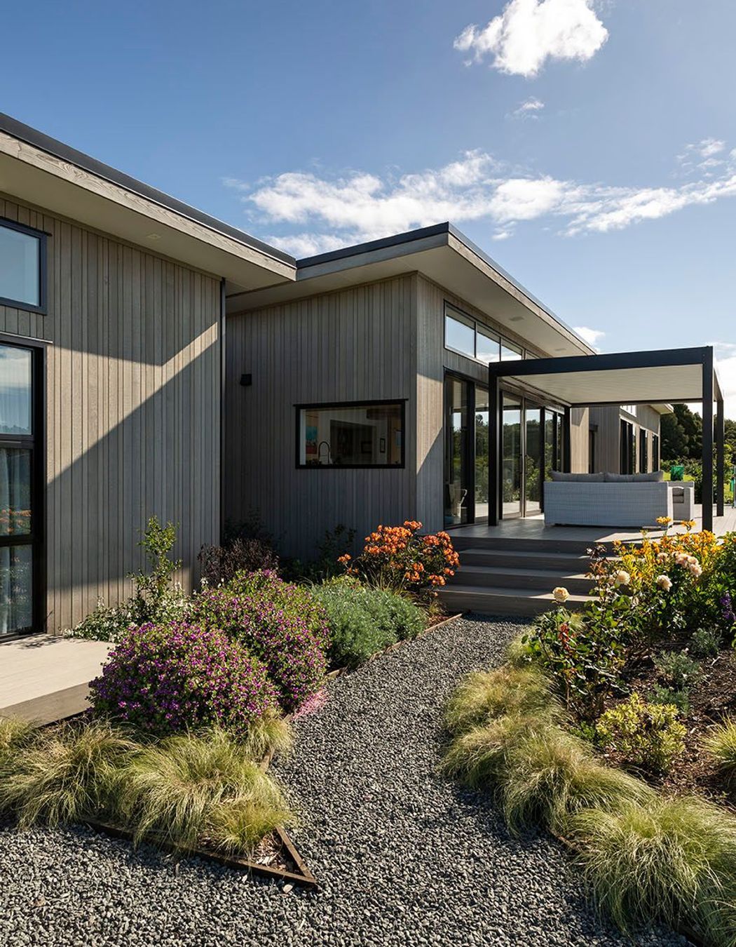 Impressive landscaping guides a viewer around the gardens and living spaces