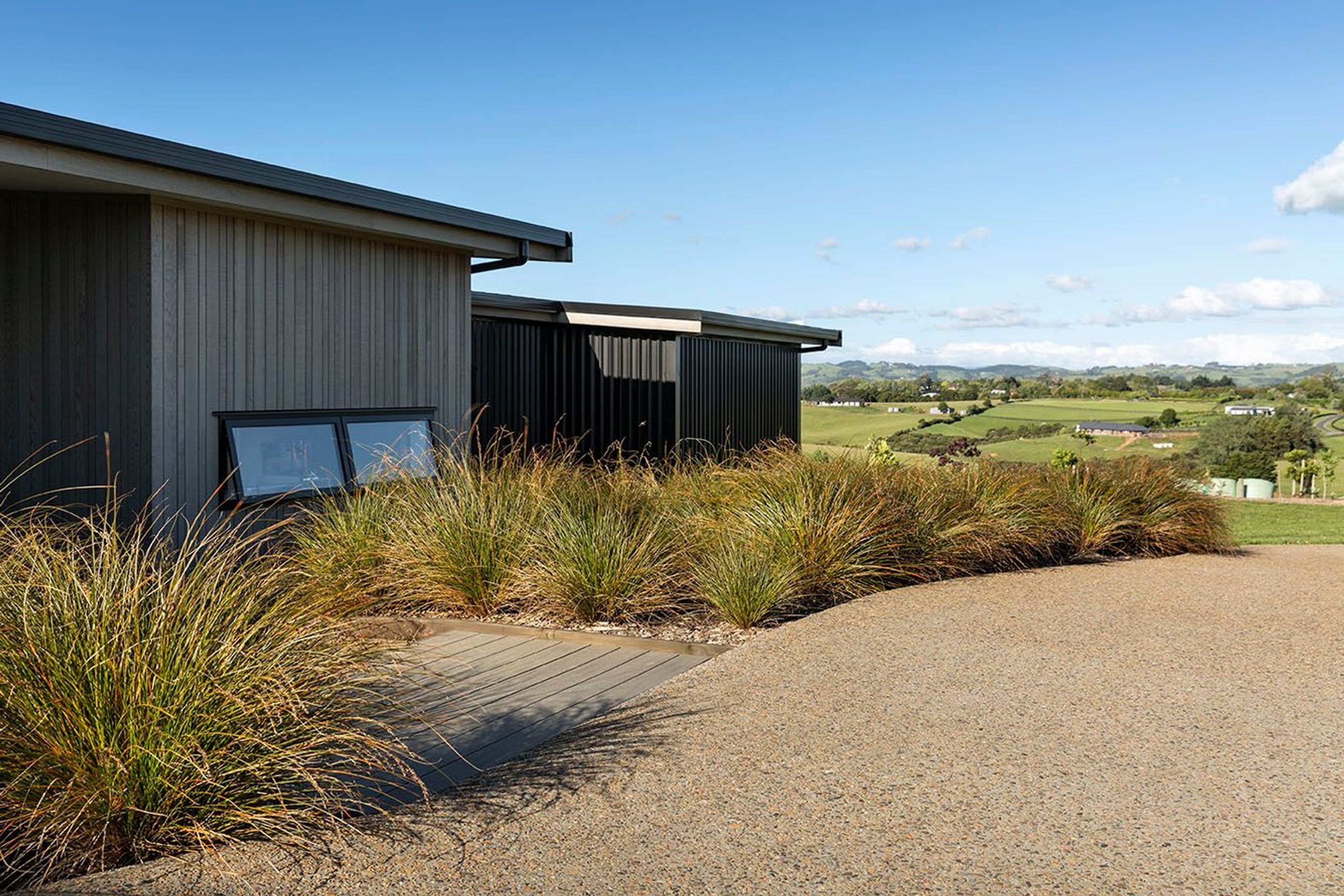 Cladding variations share vertical lines and rest well within the landscape