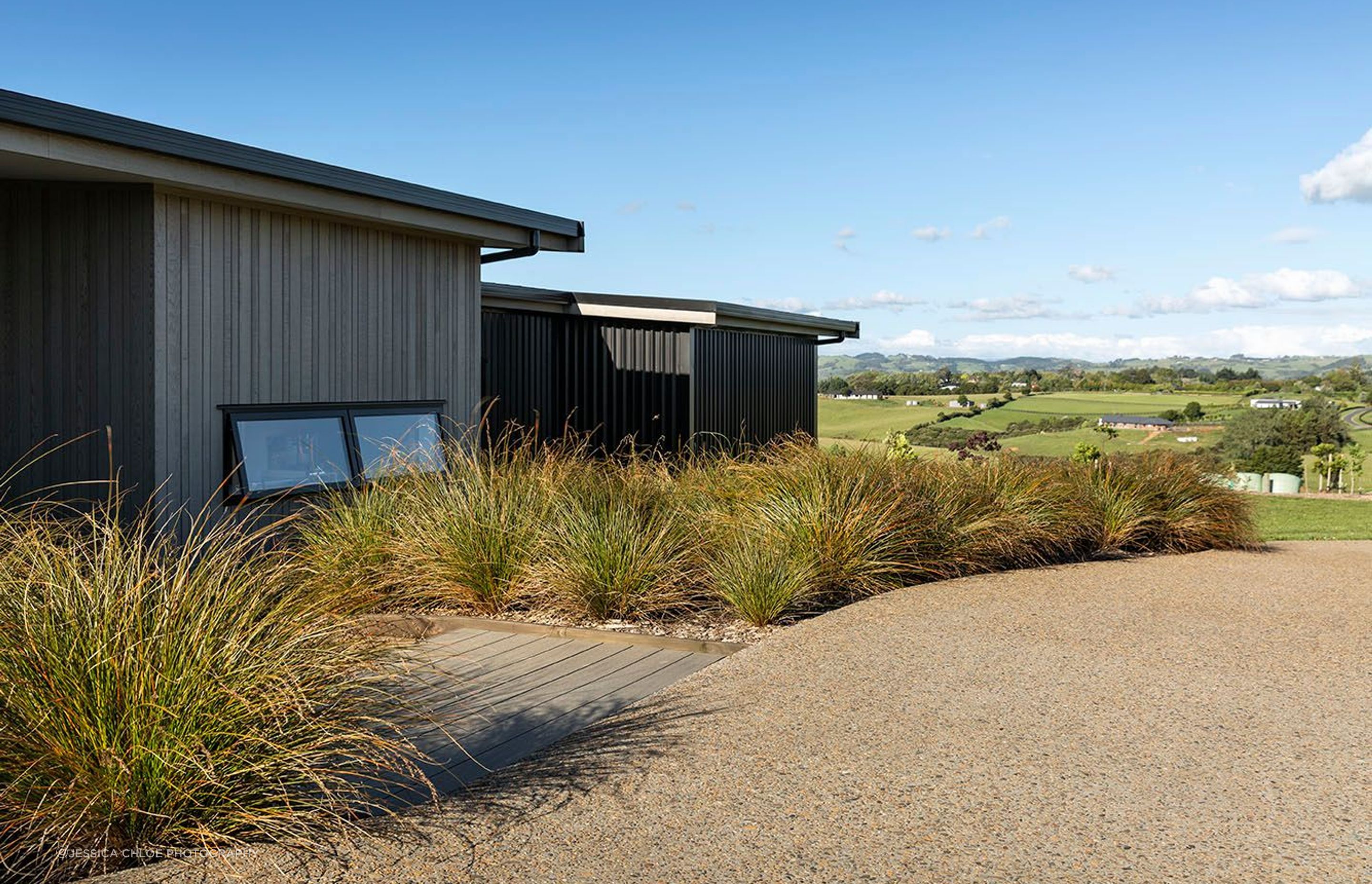 Cladding variations share vertical lines and rest well within the landscape