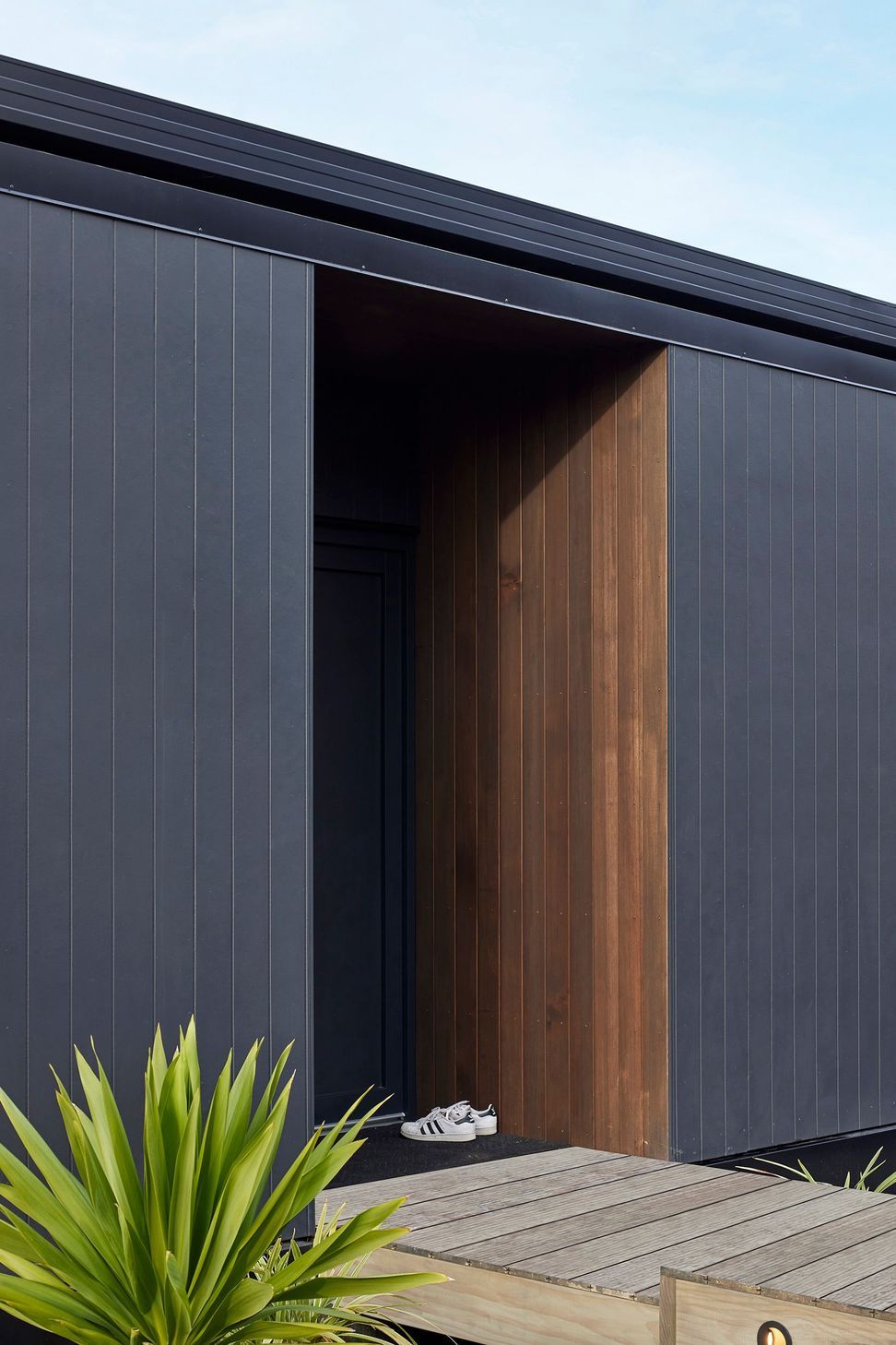 Sheltered entry space opening directly from street