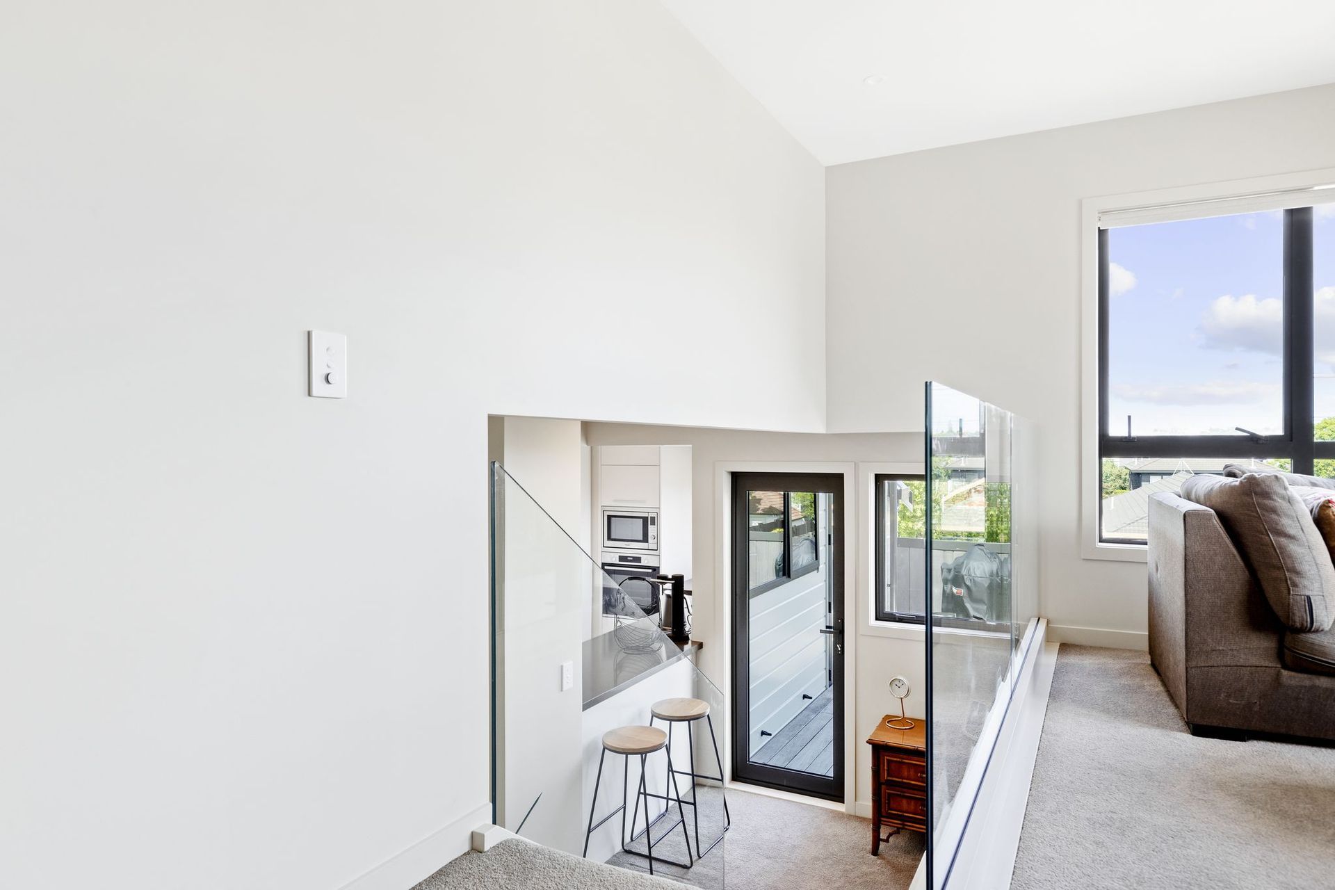 After image of the upper-level lounge and staircase