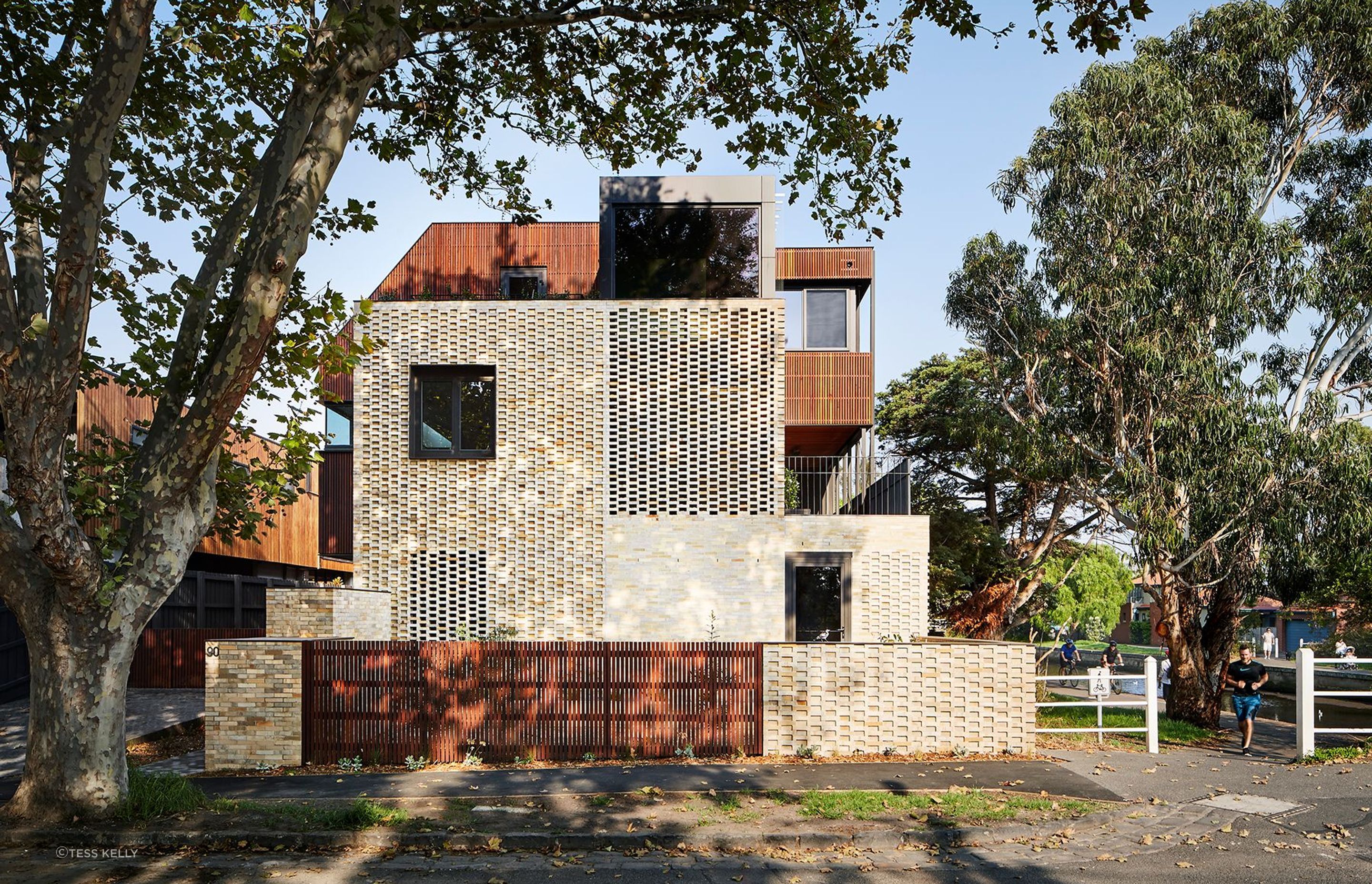 Dimpled brickwork creates a full breezeway on the east and west facades