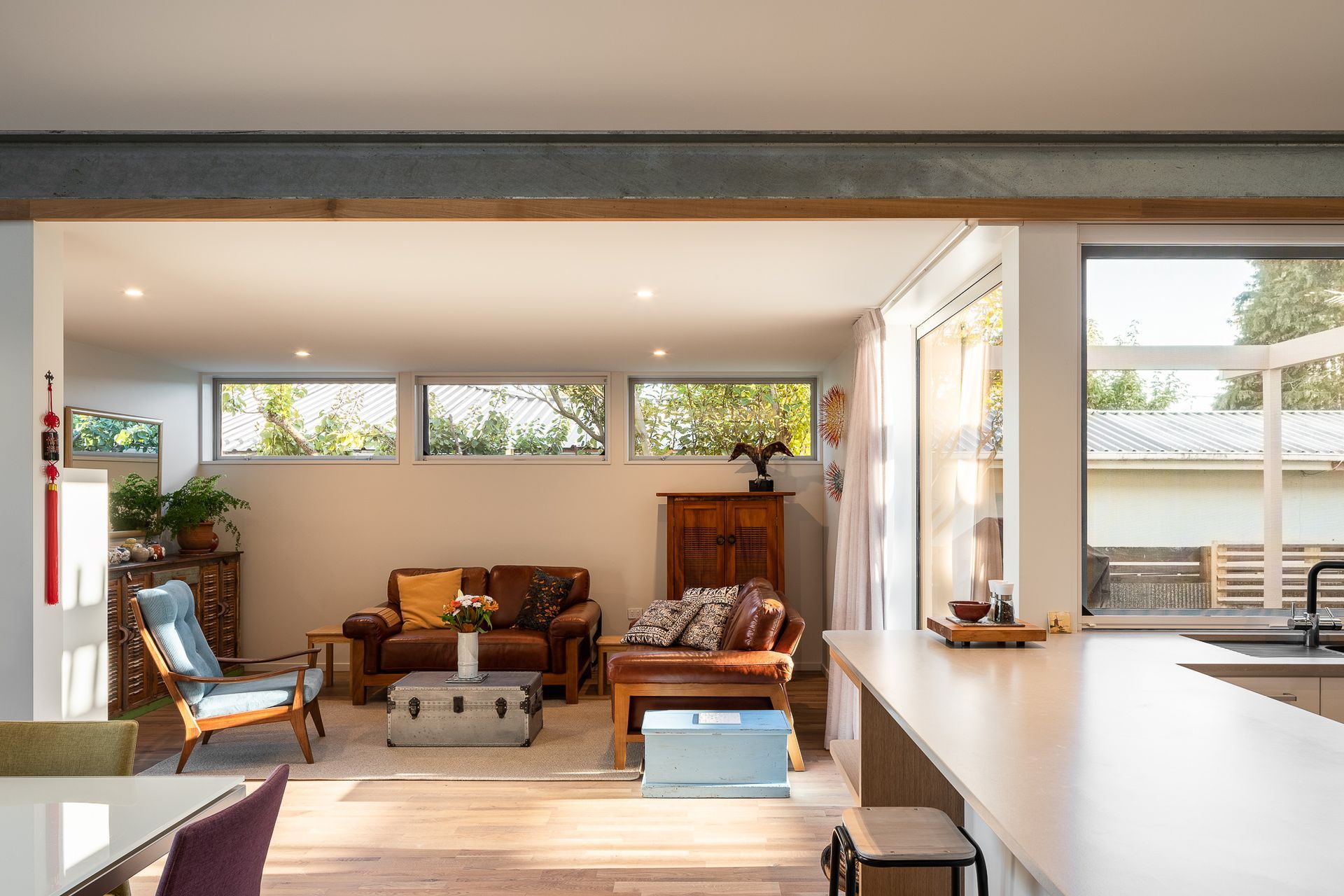 The living space adjacent to the kitchen is modest and comfortable in scale, as are the bedrooms.