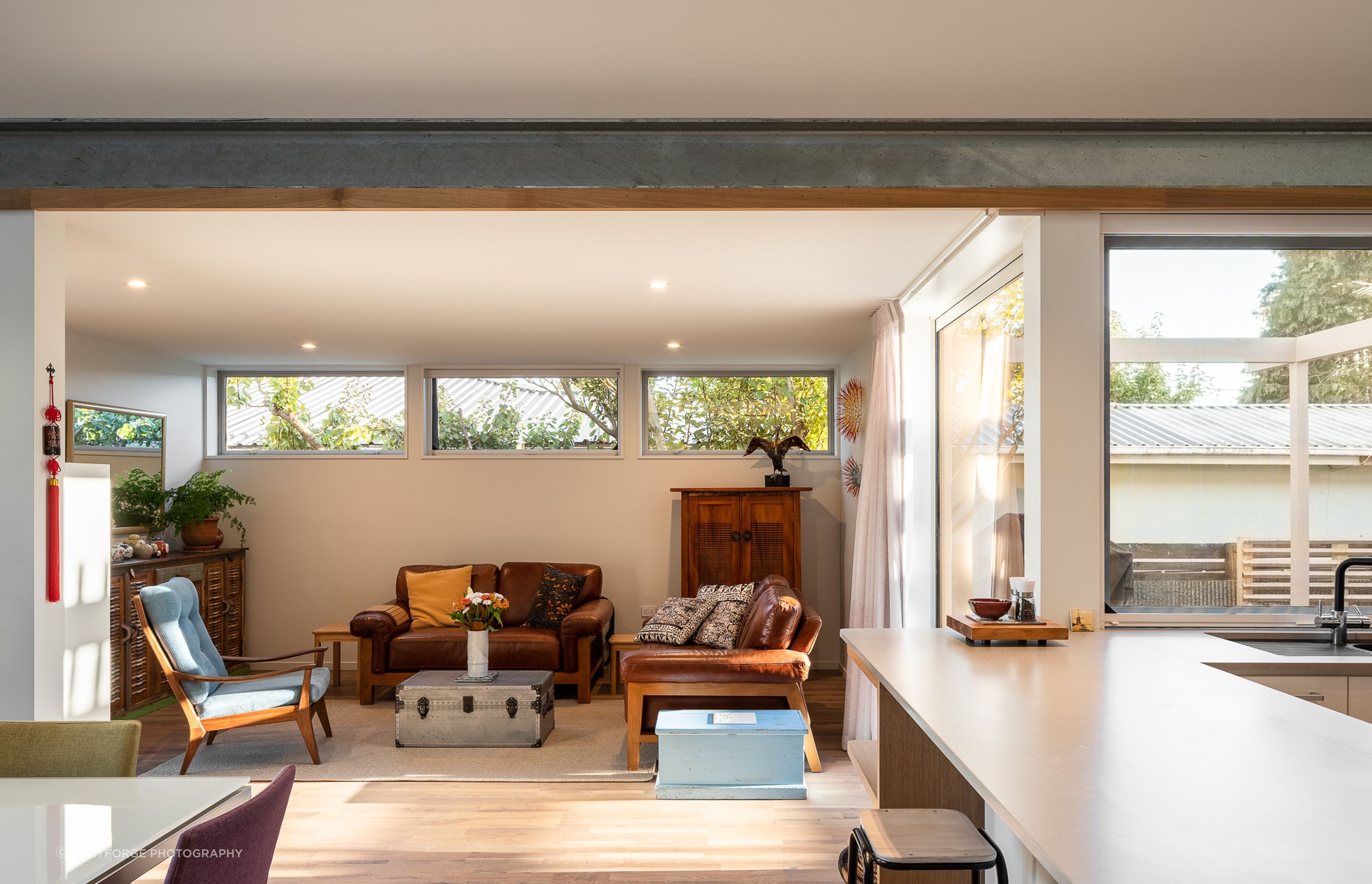 The living space adjacent to the kitchen is modest and comfortable in scale, as are the bedrooms.