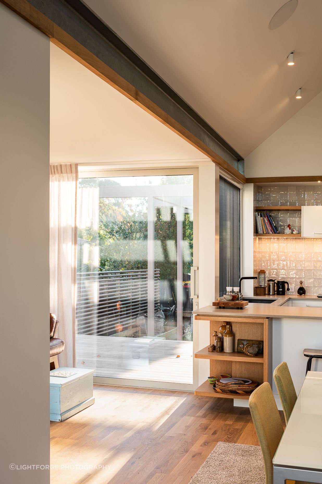 The raked ceiling in the living space offers a generous volume to the interior.