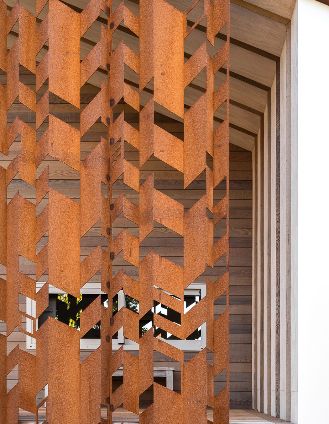 The corten steel screening at the front of the home.