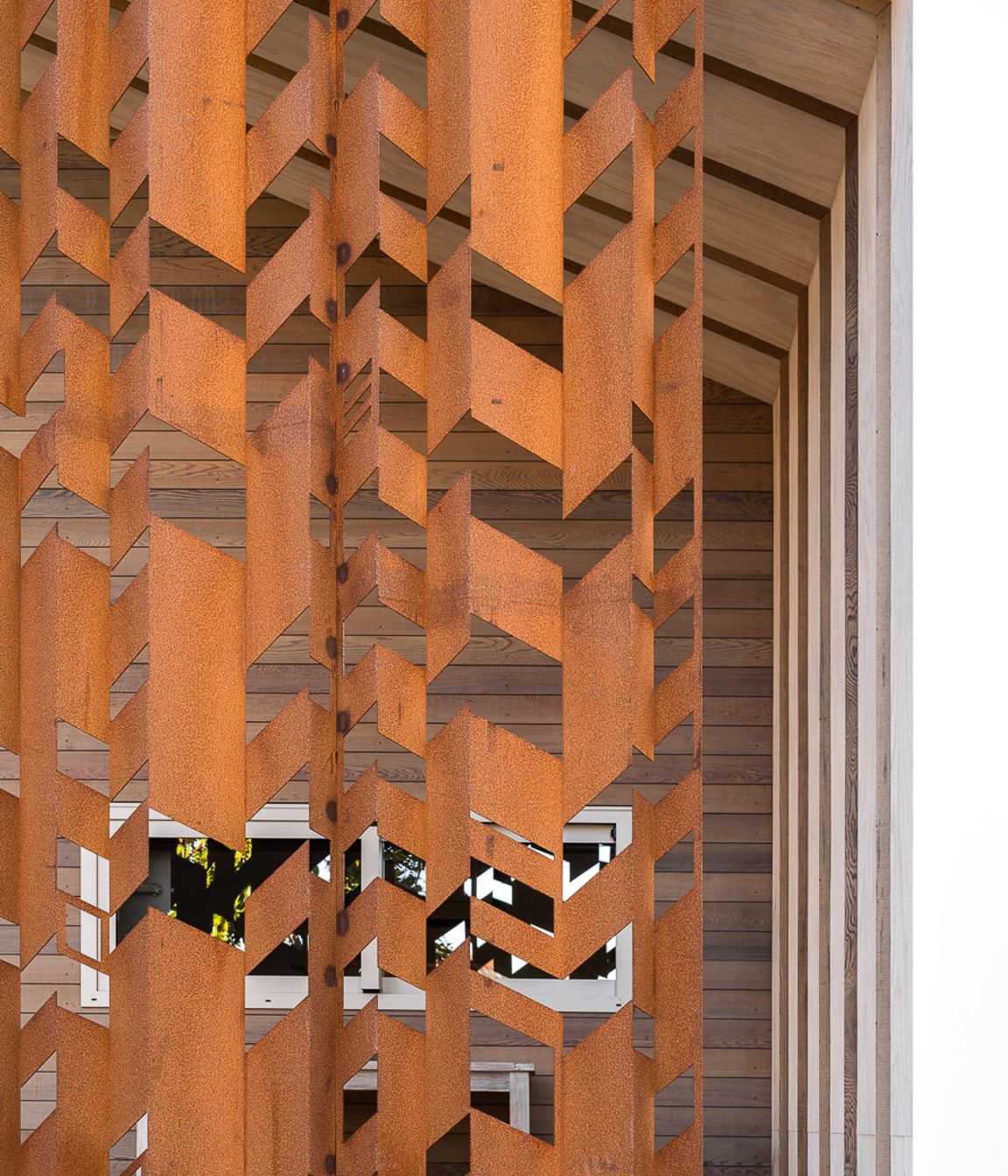 The corten steel screening at the front of the home.