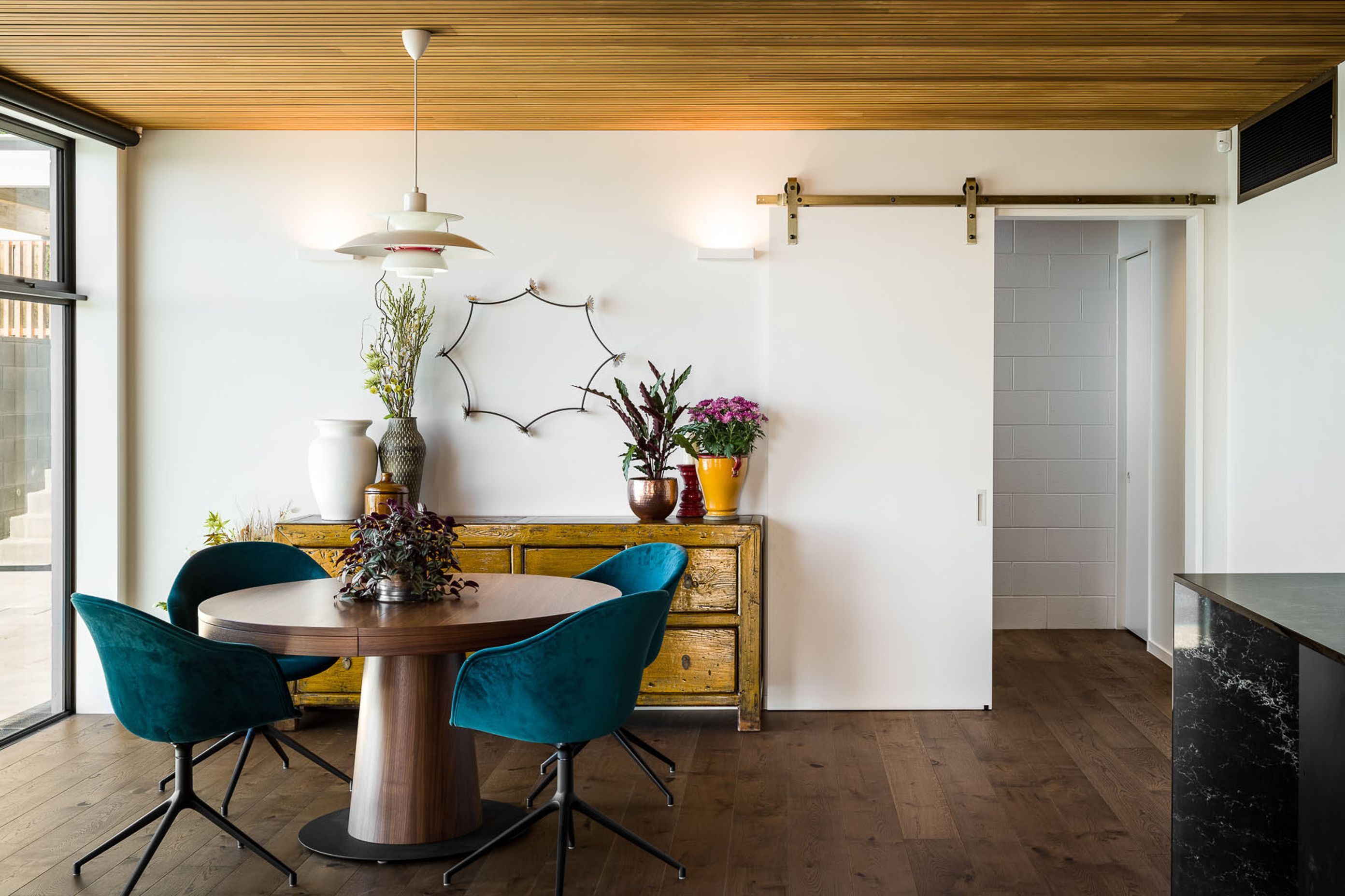 An eclectic mix of furniture and accessories complements the architectural styling creating a classic modern interior.