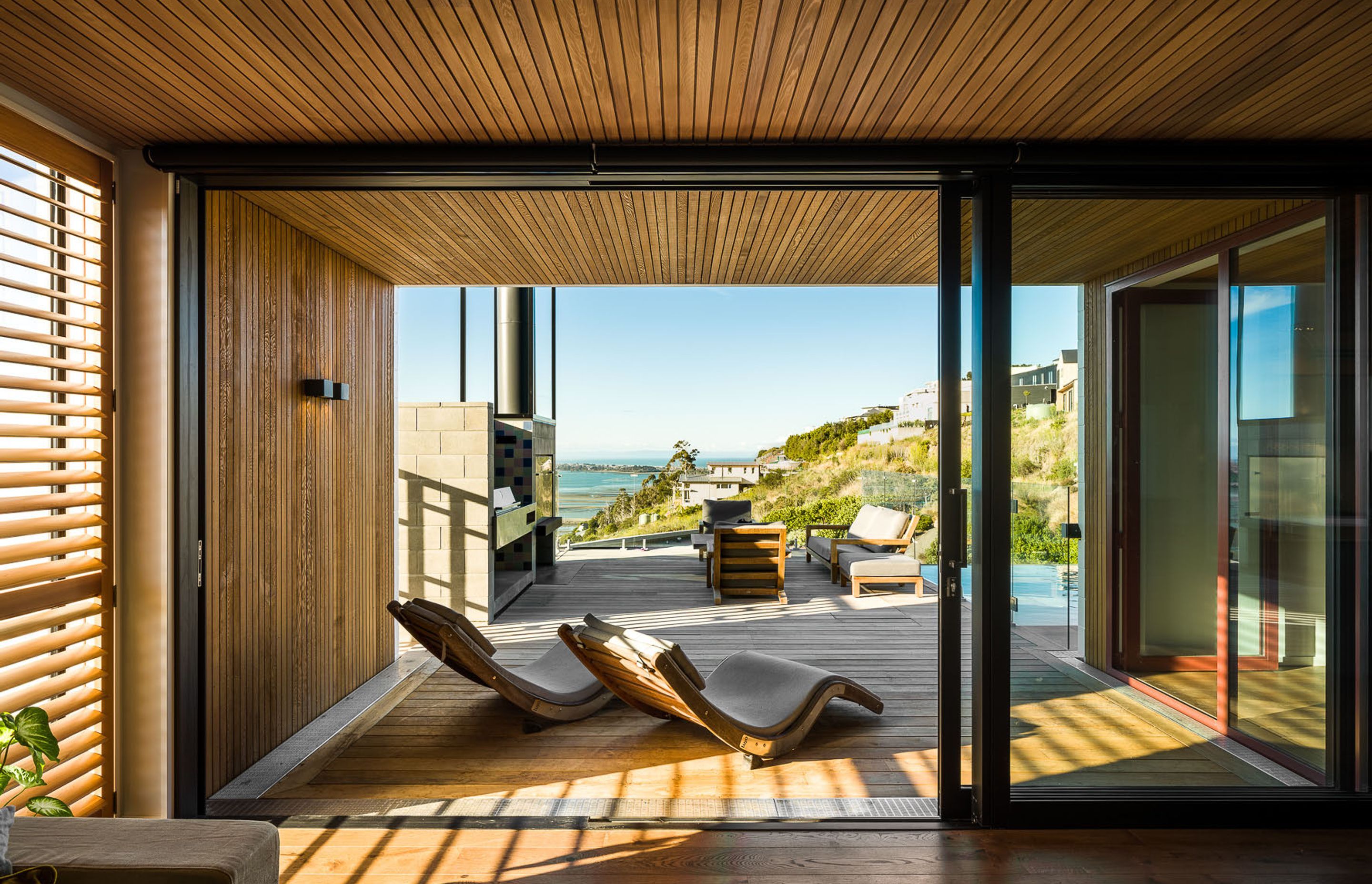 The living areas and outdoor spaces have been recessed into the building line to mitigate solar gain. The deep overhangs also help to frame the view, creating vignettes from every room.
