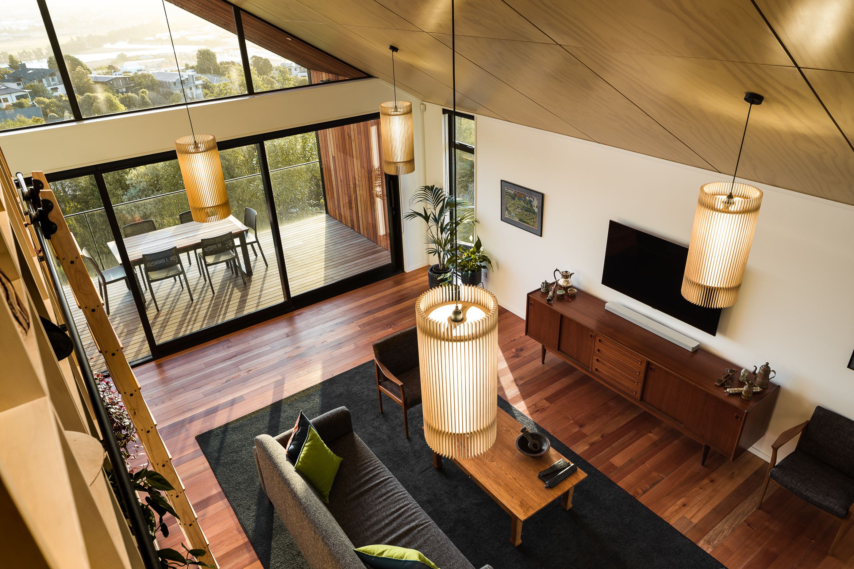 The double-height living area adds volumetric drama to the interior.