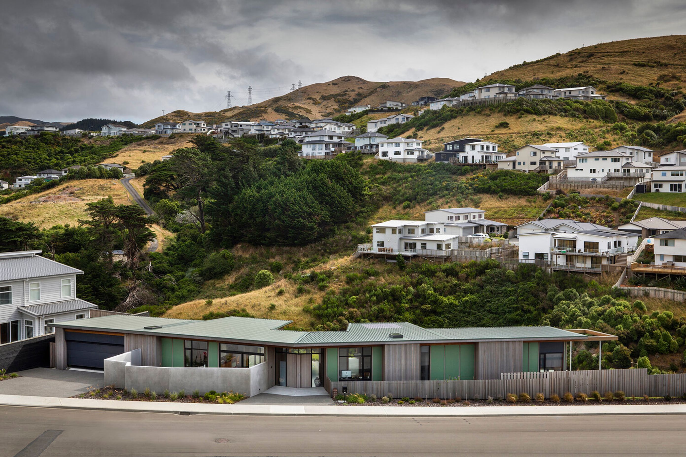 Architect Gerald Parsonson says the owners of this property wanted a home that differed from the 'boxy' homes around them and which celebrated its surroundings through the usual of natural materials and complementary colours.
