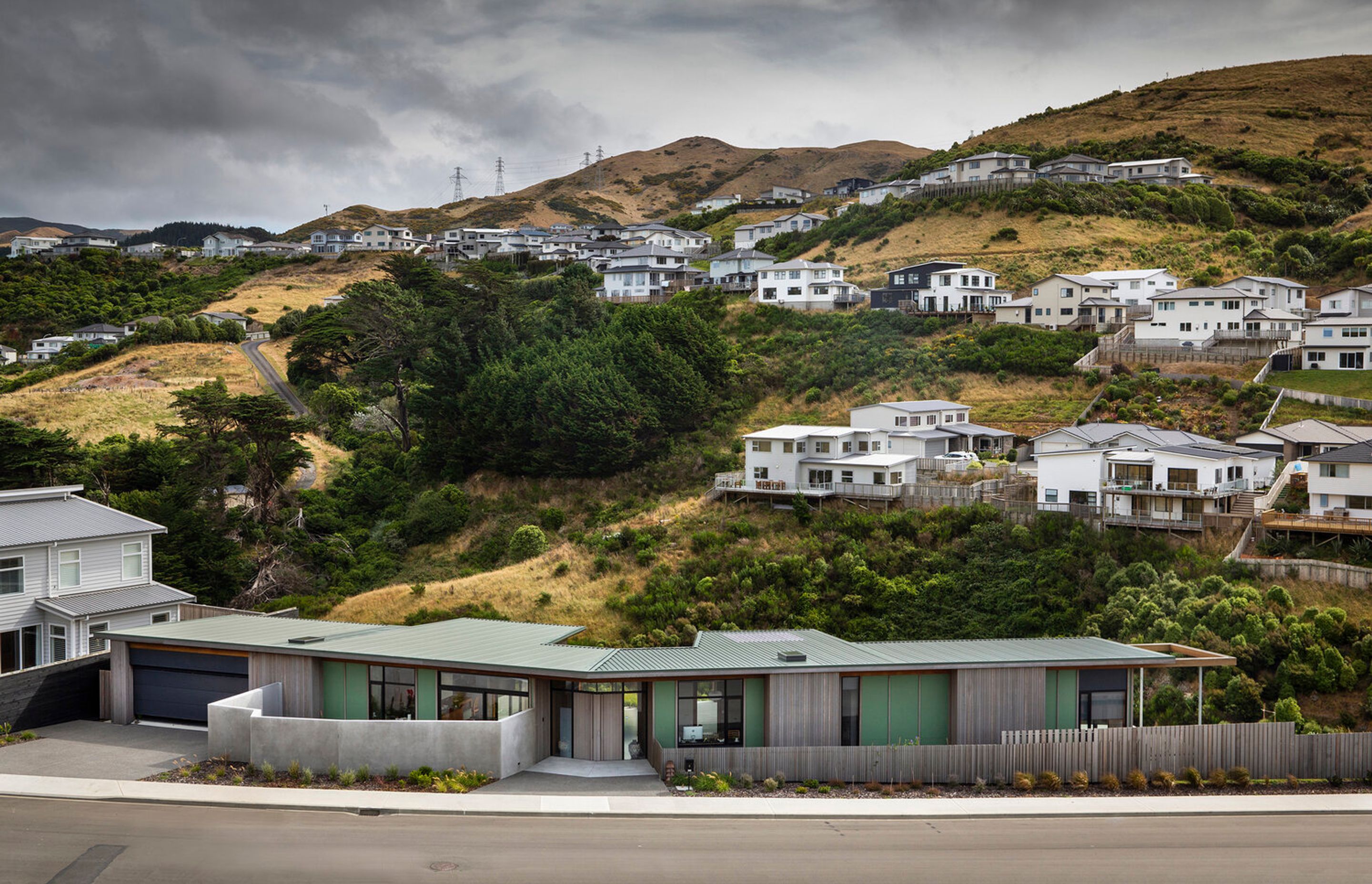 Architect Gerald Parsonson says the owners of this property wanted a home that differed from the 'boxy' homes around them and which celebrated its surroundings through the usual of natural materials and complementary colours.