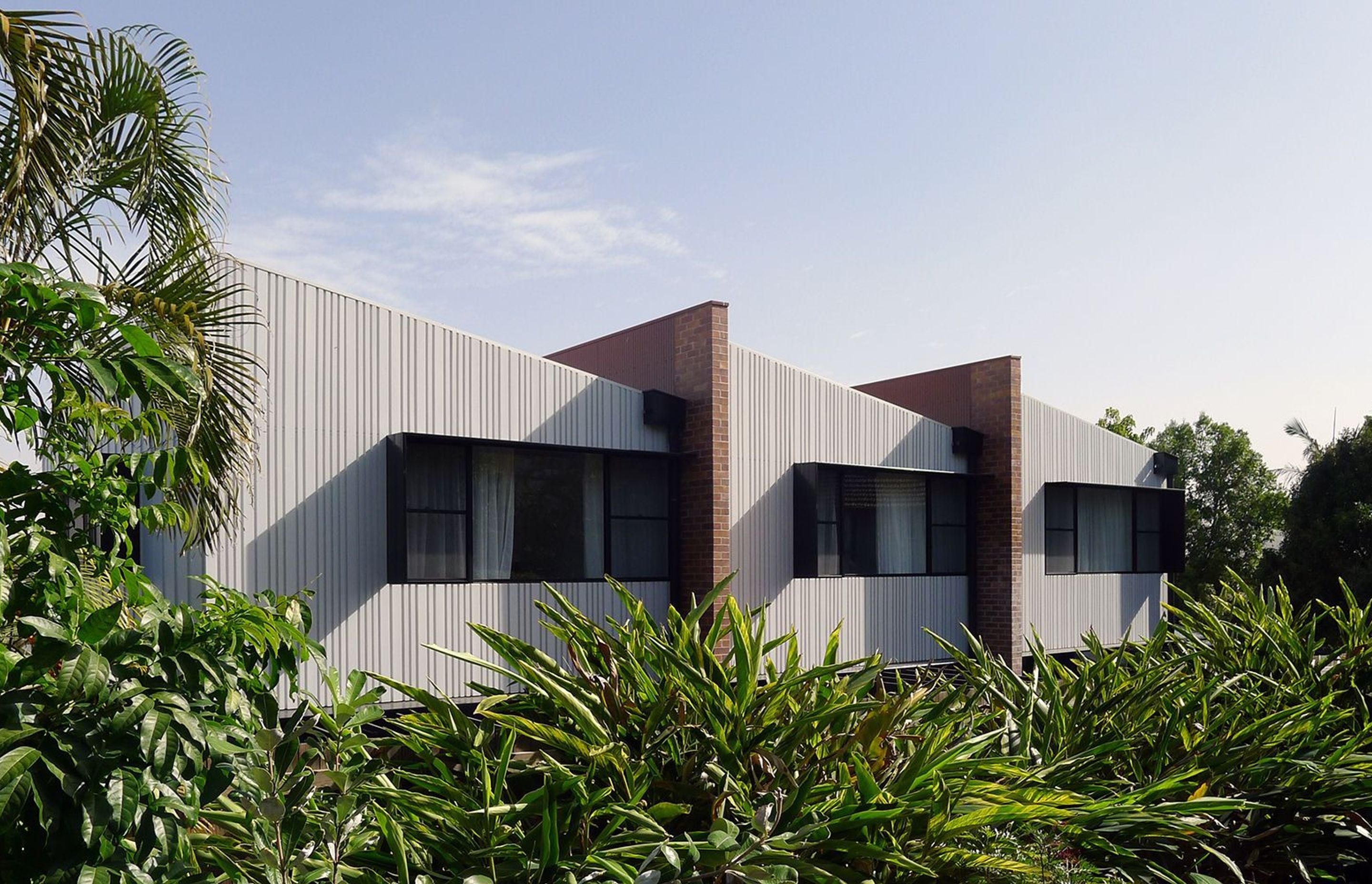 Photography: Cathy Schusler | Longfellow Terraces townhouses nestle well into the surrounding suburban landscape.