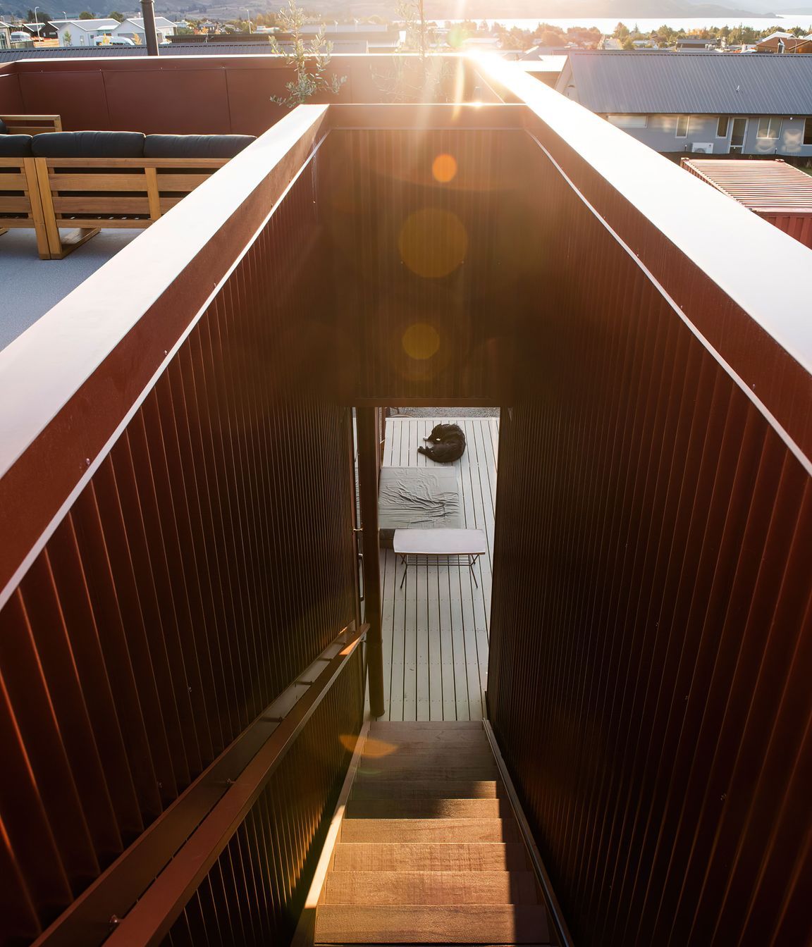 The decking around the house is Abodo Wood.