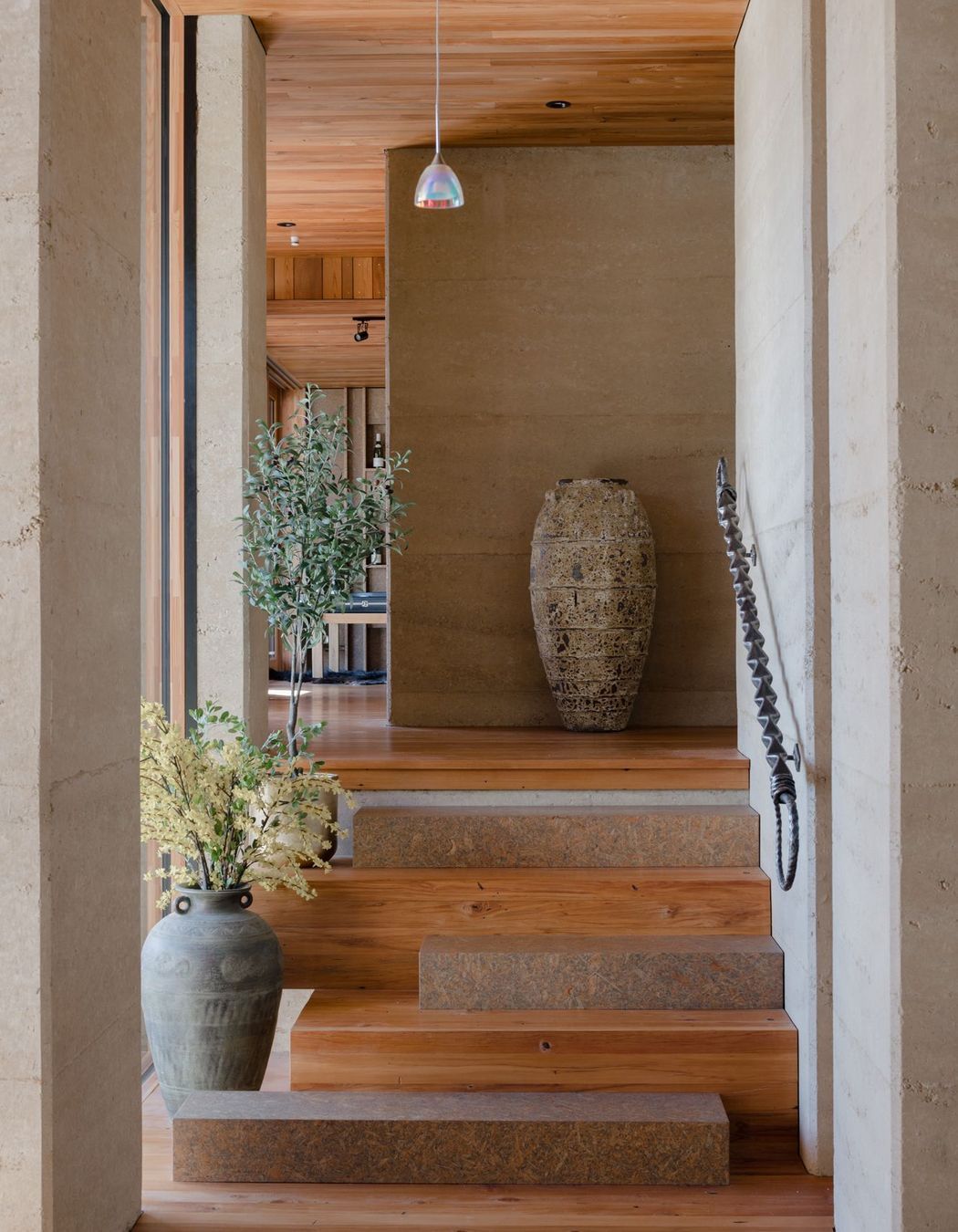 Strand board elements can be found throughout the home, in this instance as every second stair.