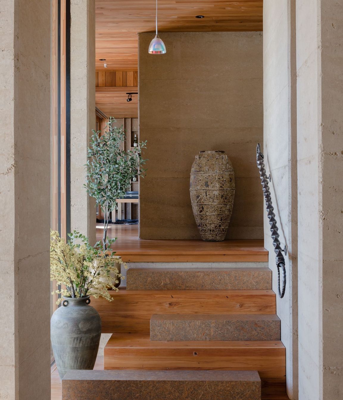 Strand board elements can be found throughout the home, in this instance as every second stair.