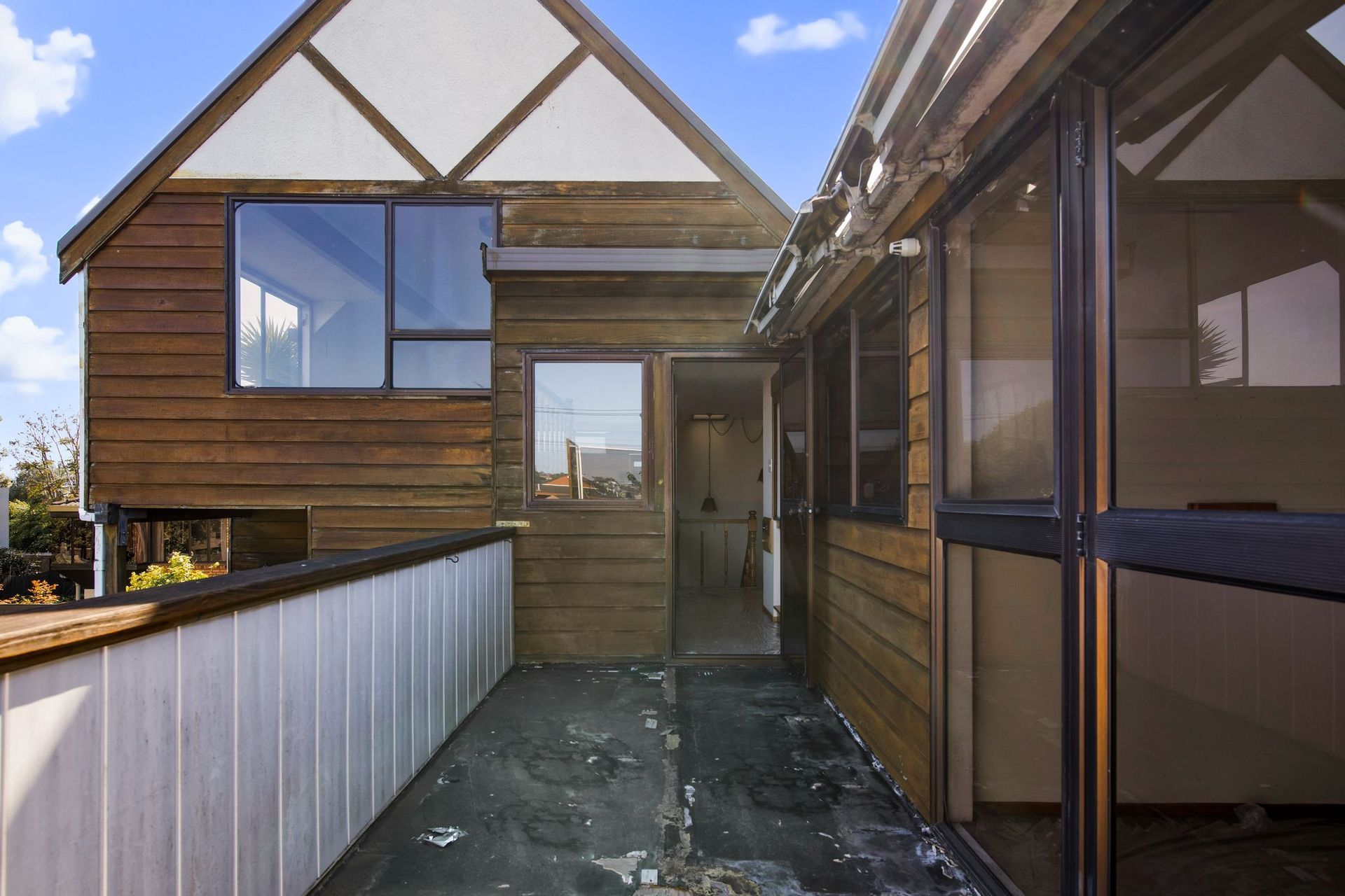 Before image of the patio with sliding doors