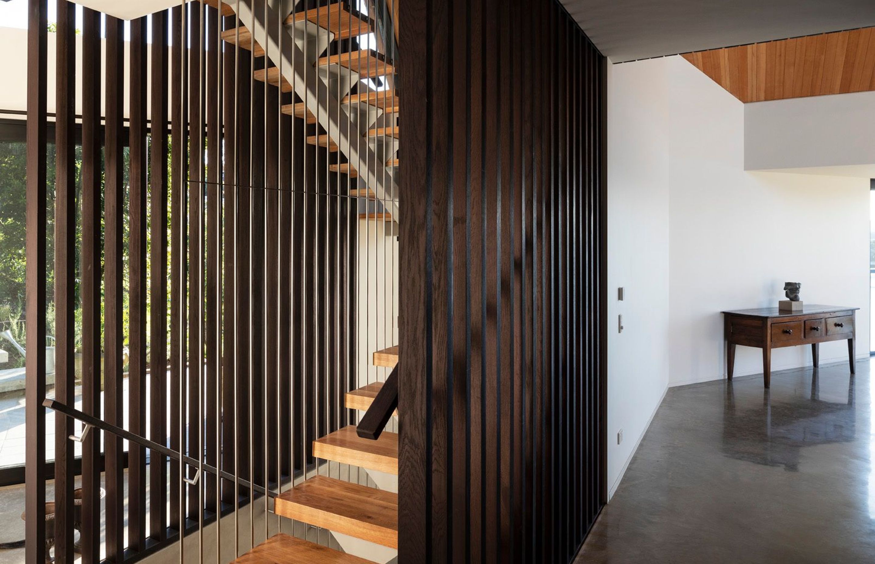 Entry to the house is situated five-metres below the main floor level. A three-storey staircase connects the entry level with the main floor as well as the mezzanine main bedroom.