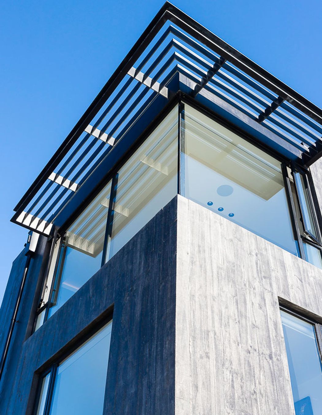 The master bedroom is protected from the sun by screening above.