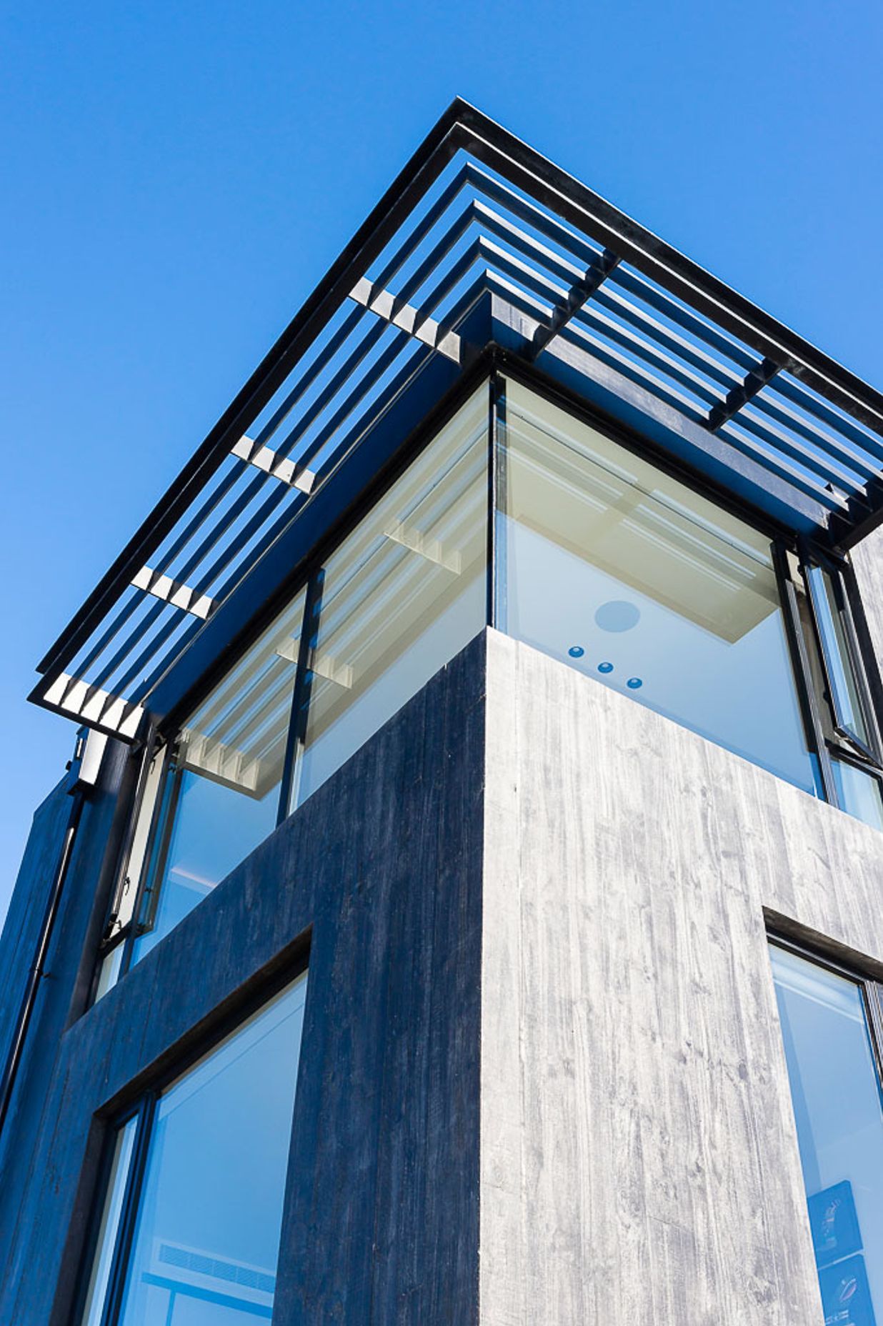 The master bedroom is protected from the sun by screening above.