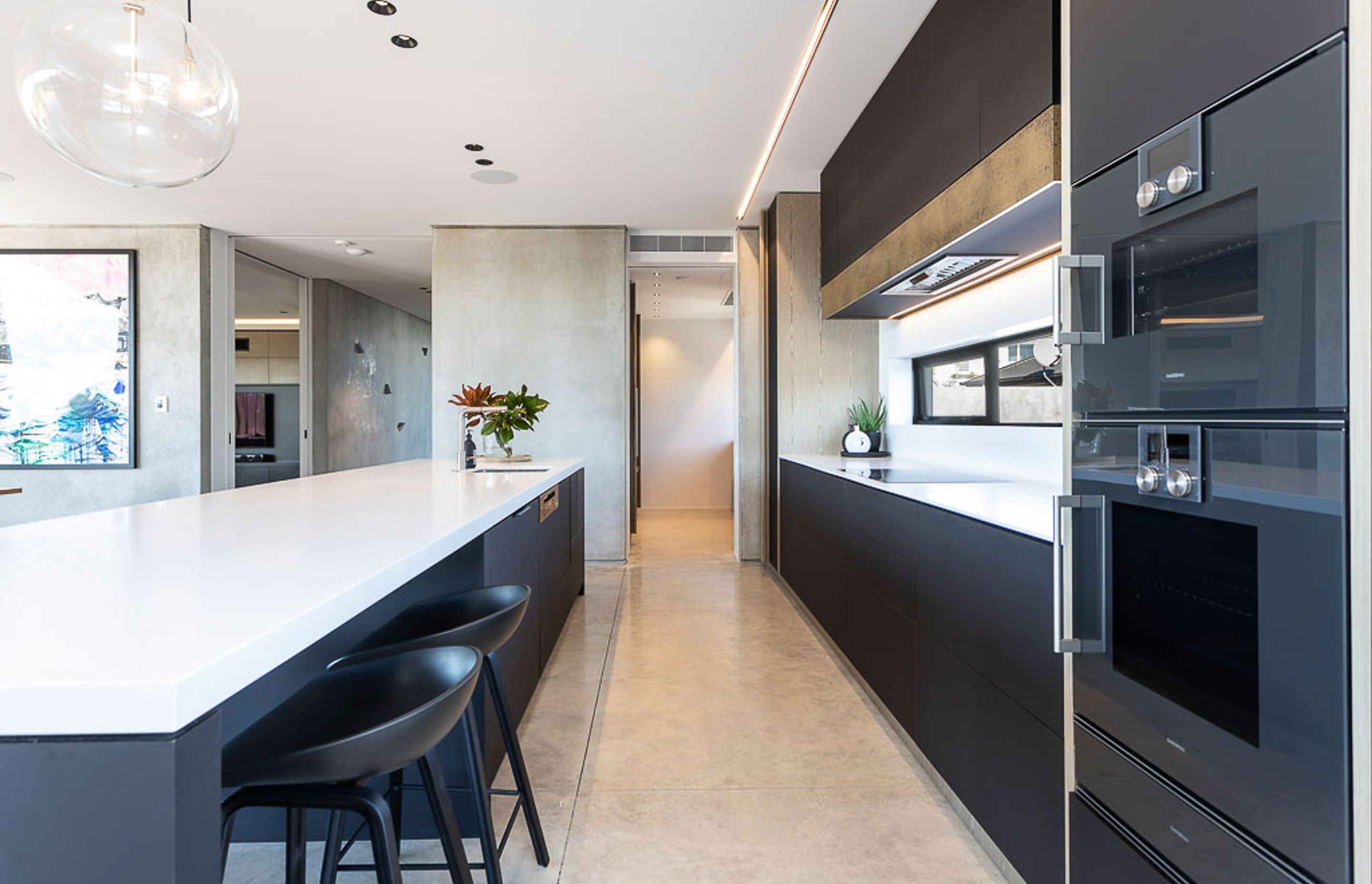 A scullery at the rear of the kitchen provides a space to hide kitchen clutter.