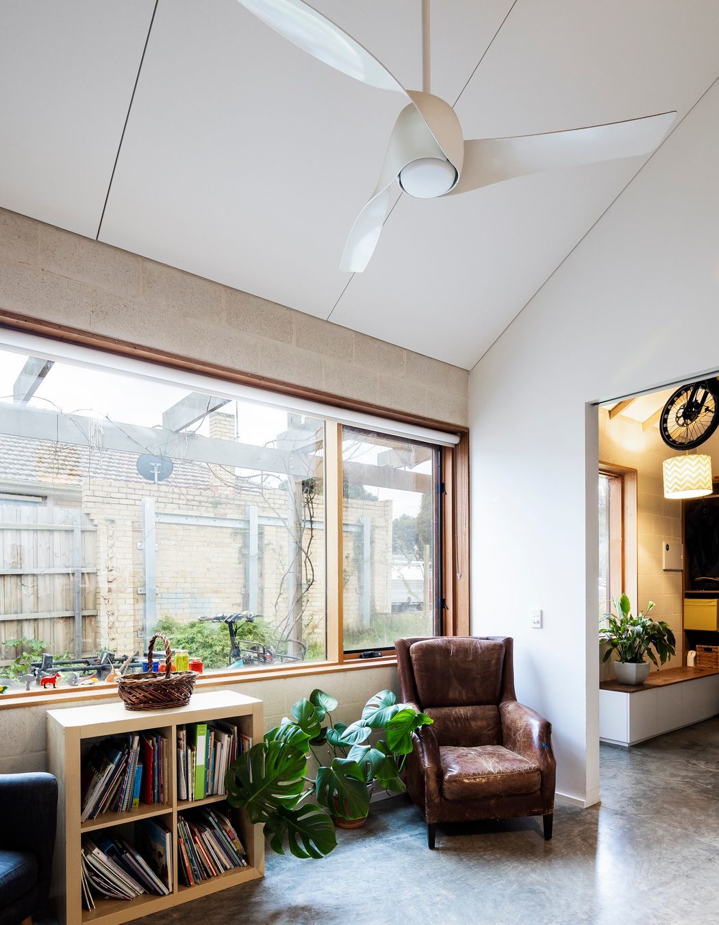 A sun-filled living room with lots of exposed internal thermal mass for heat storage