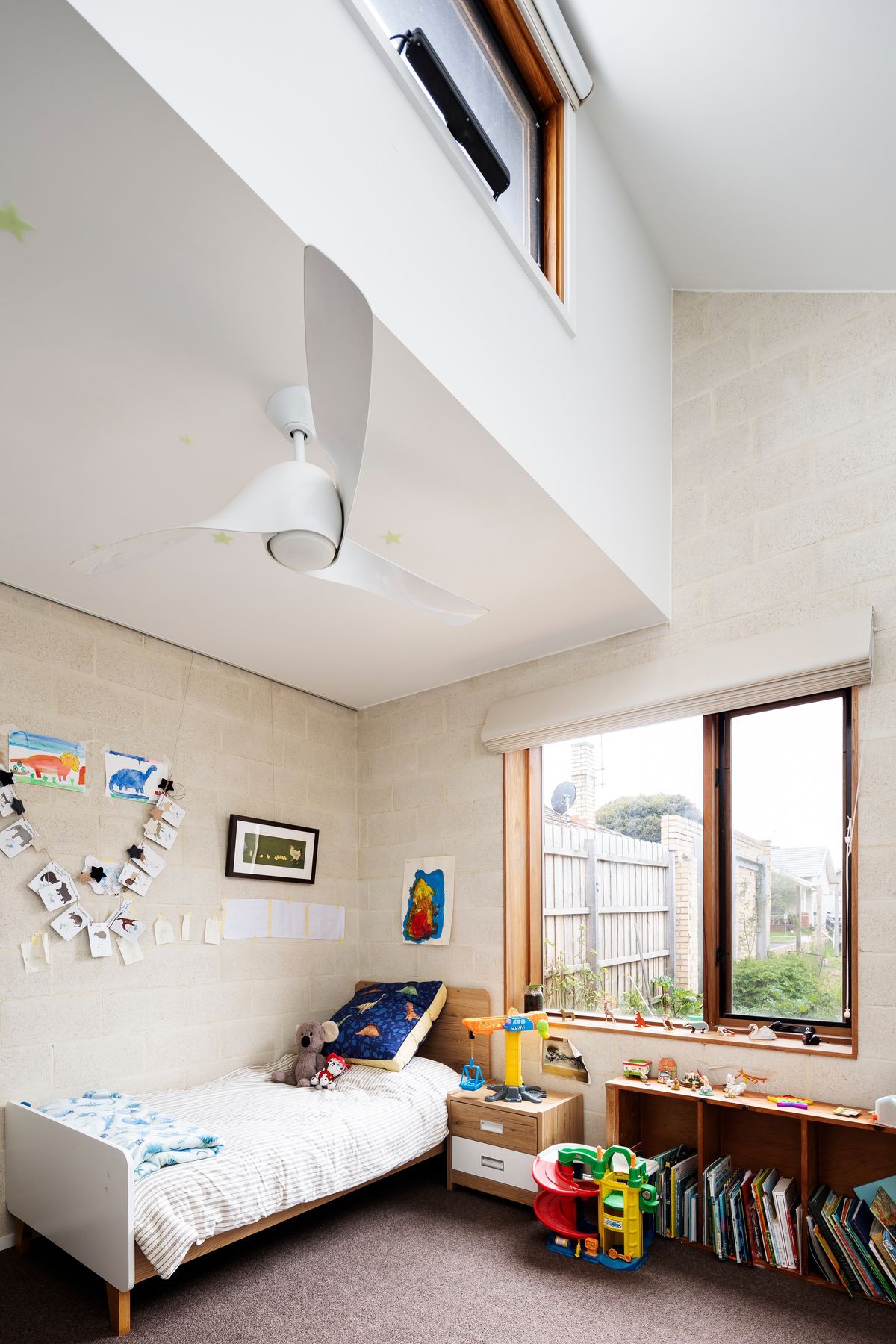 High level windows and ceiling sweep fans for good ventilation and passive solar