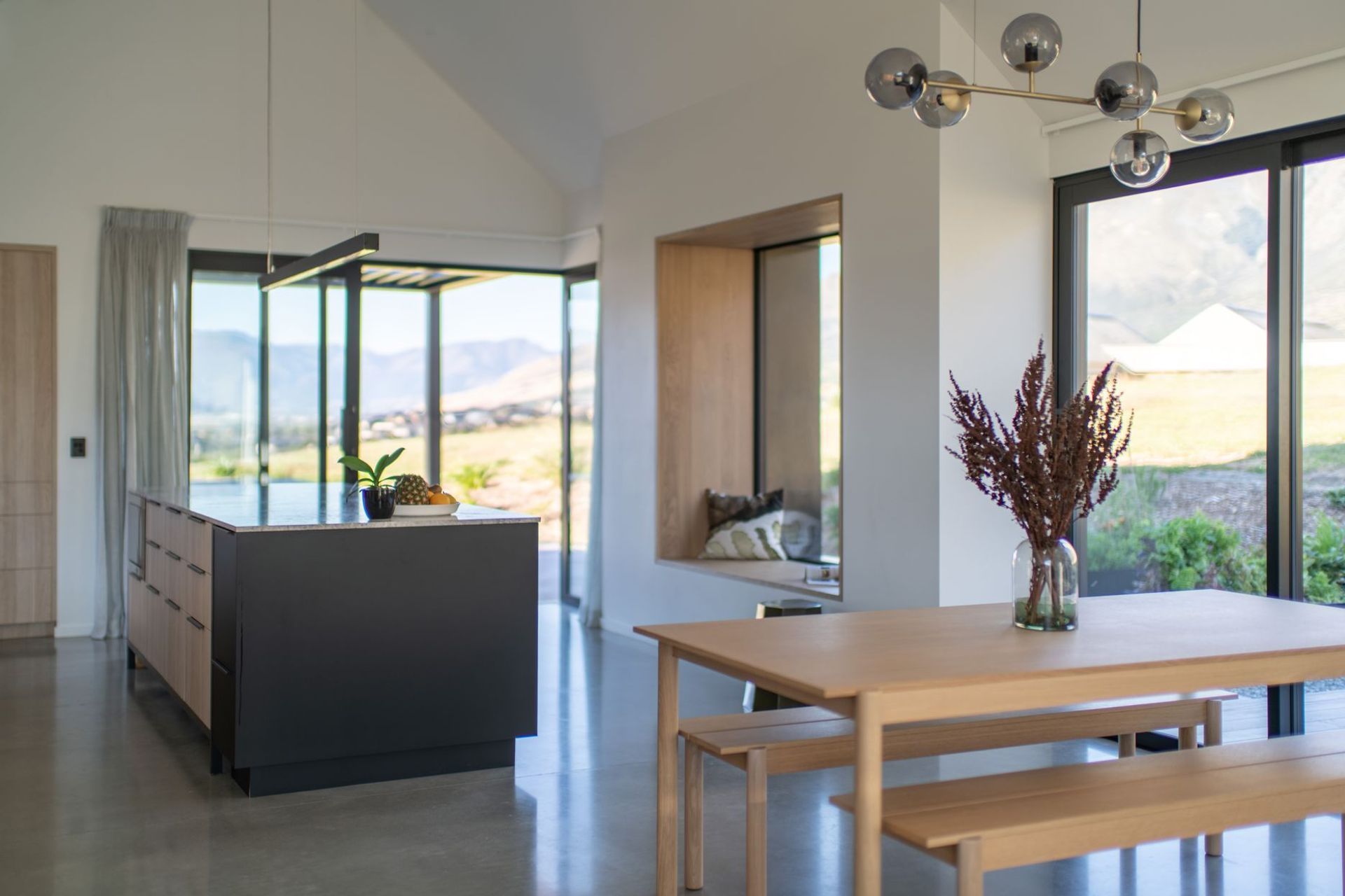 The open-plan kitchen/dining space takes in a huge amount of natural light through extensive glazing.