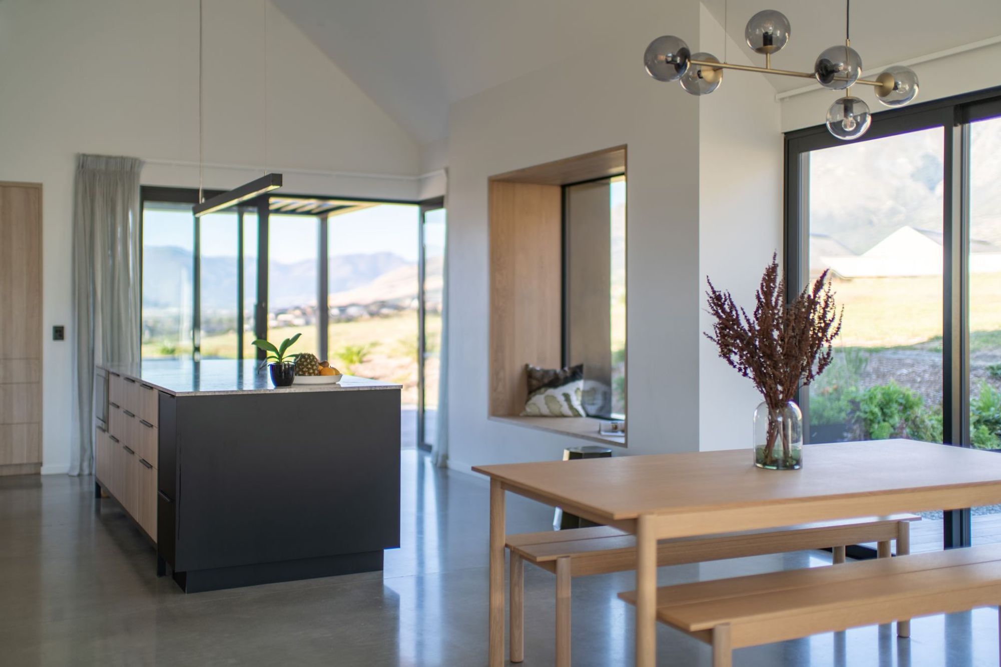 The open-plan kitchen/dining space takes in a huge amount of natural light through extensive glazing.