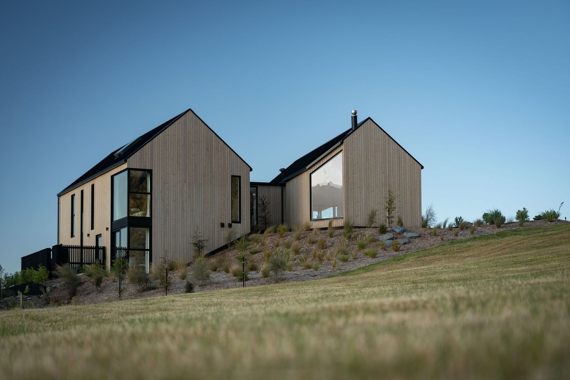 The glazing is cut neatly into the building's facade, creating a clean and geometric aesthetic.