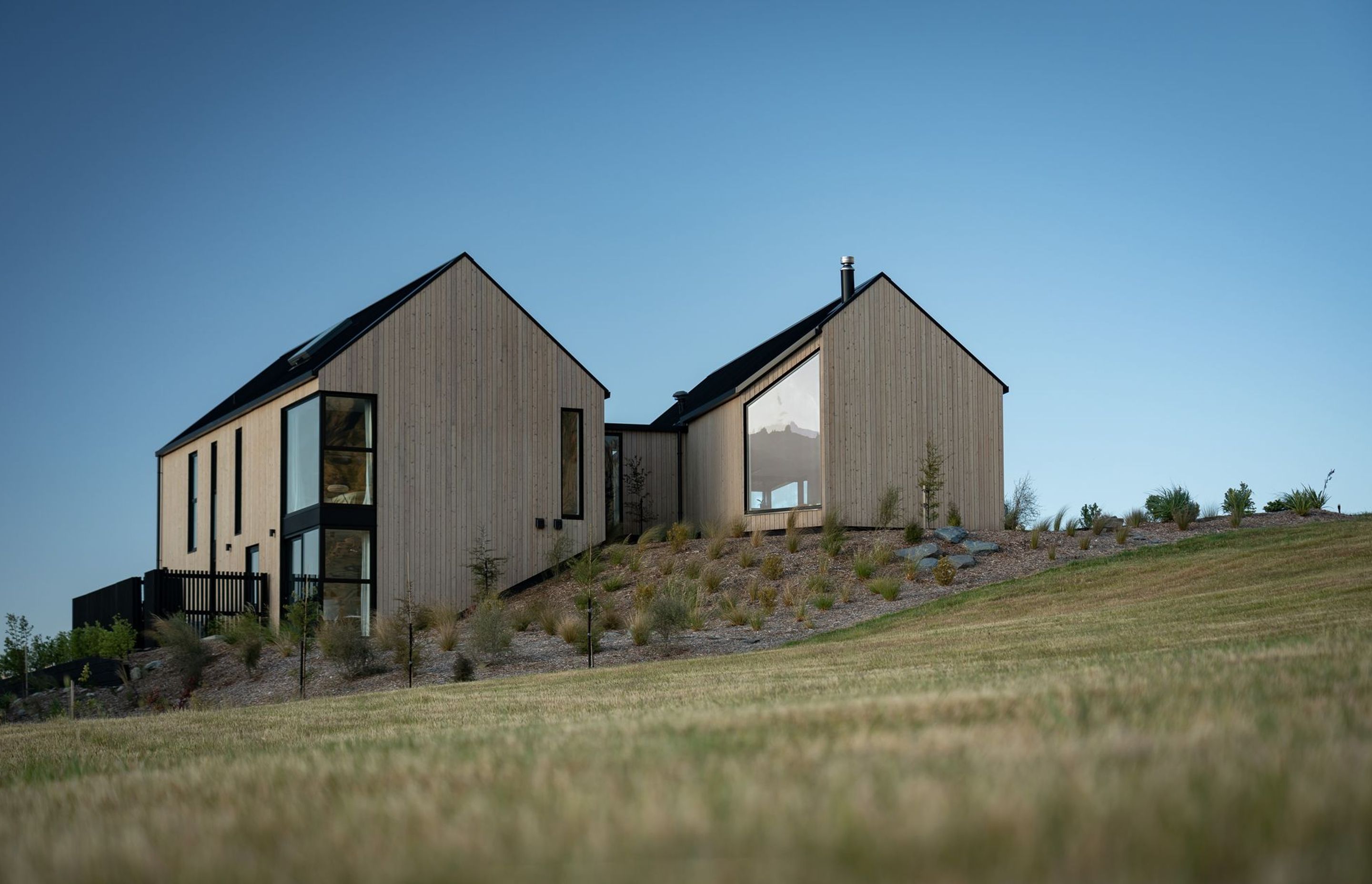 The glazing is cut neatly into the building's facade, creating a clean and geometric aesthetic.