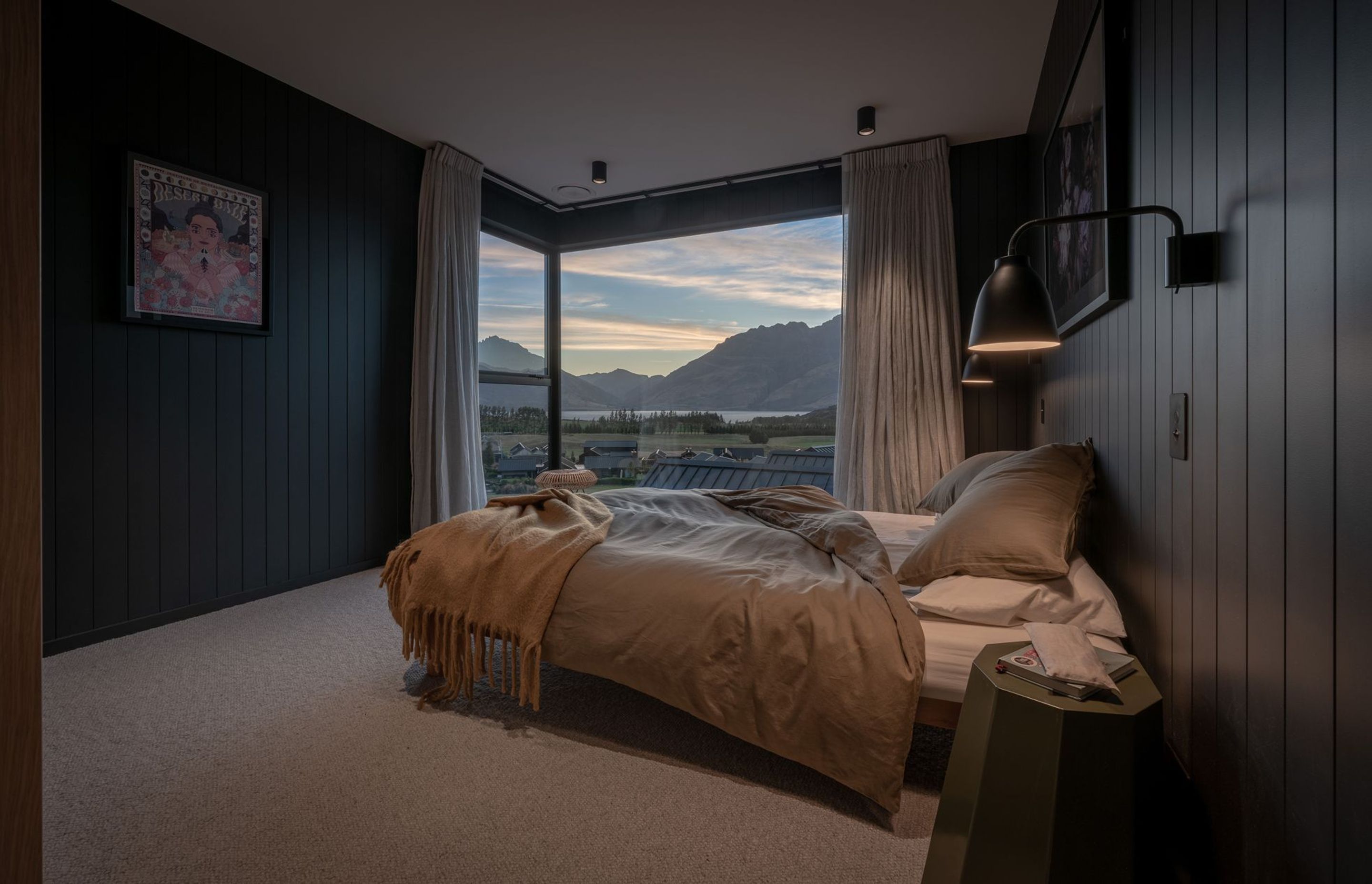 The master bedroom is compact in size, yet takes in a remarkable view.