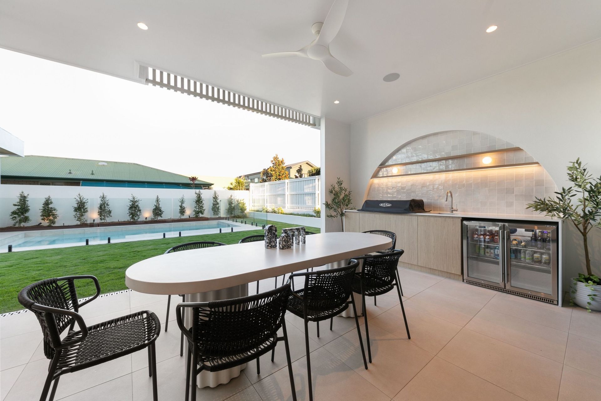An arched, tiled nook turns the barbecue into part of the architecture.
