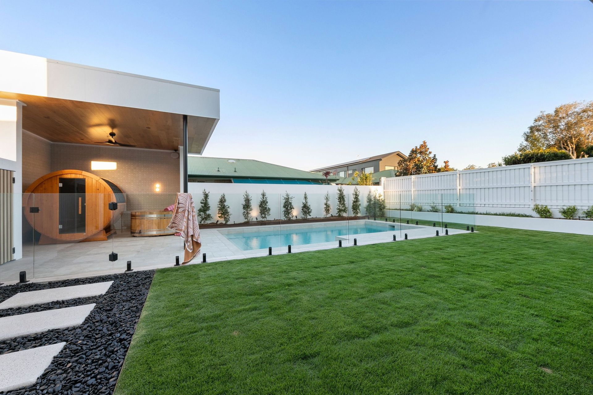 Lawn, pool and terrace share the yard without any one of them dominating.