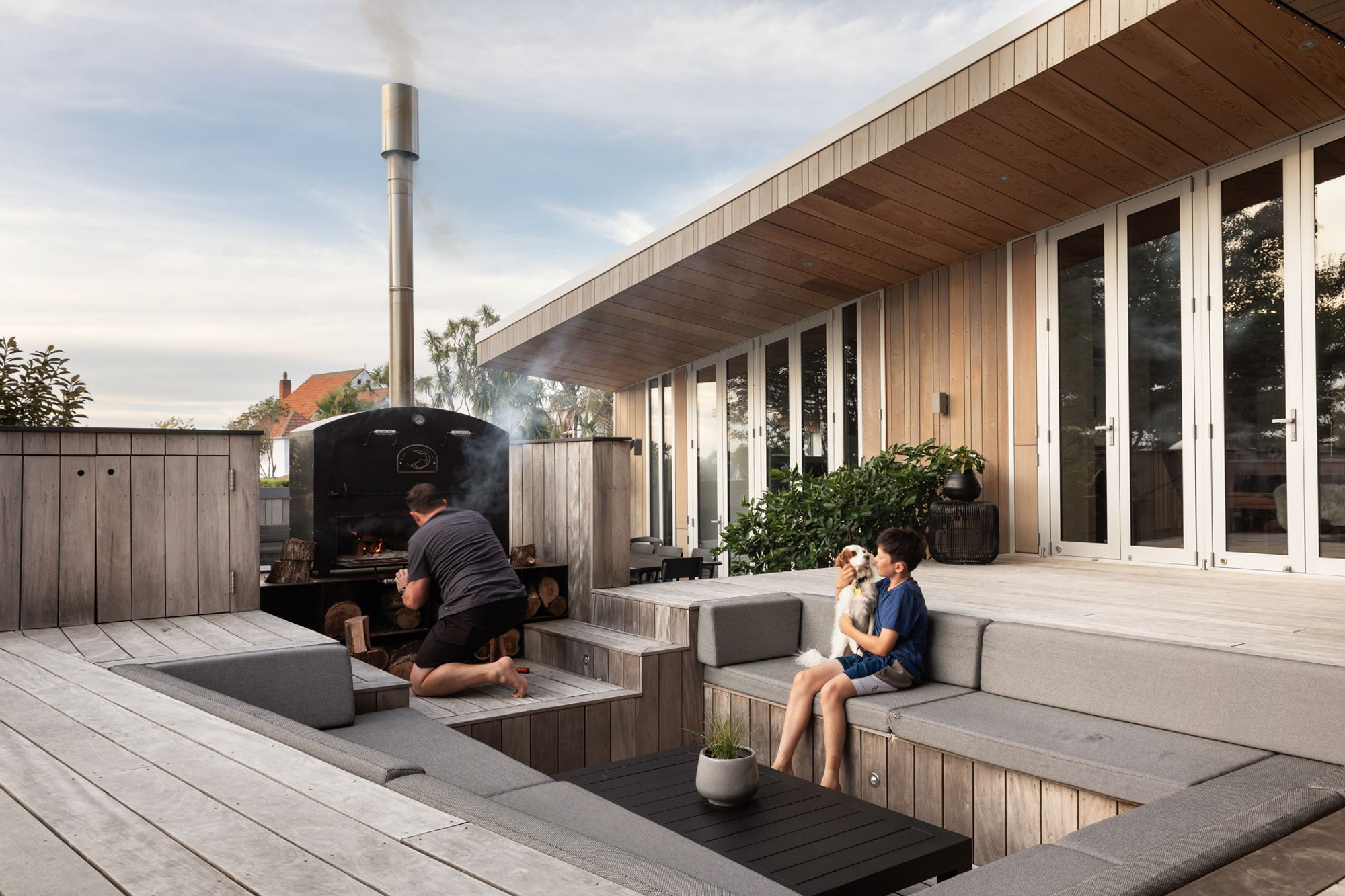 The sunken outdoor setting was designed to place people at eye level to the outdoor fire; creating a greater sense of intimacy than if they were sitting at a table.