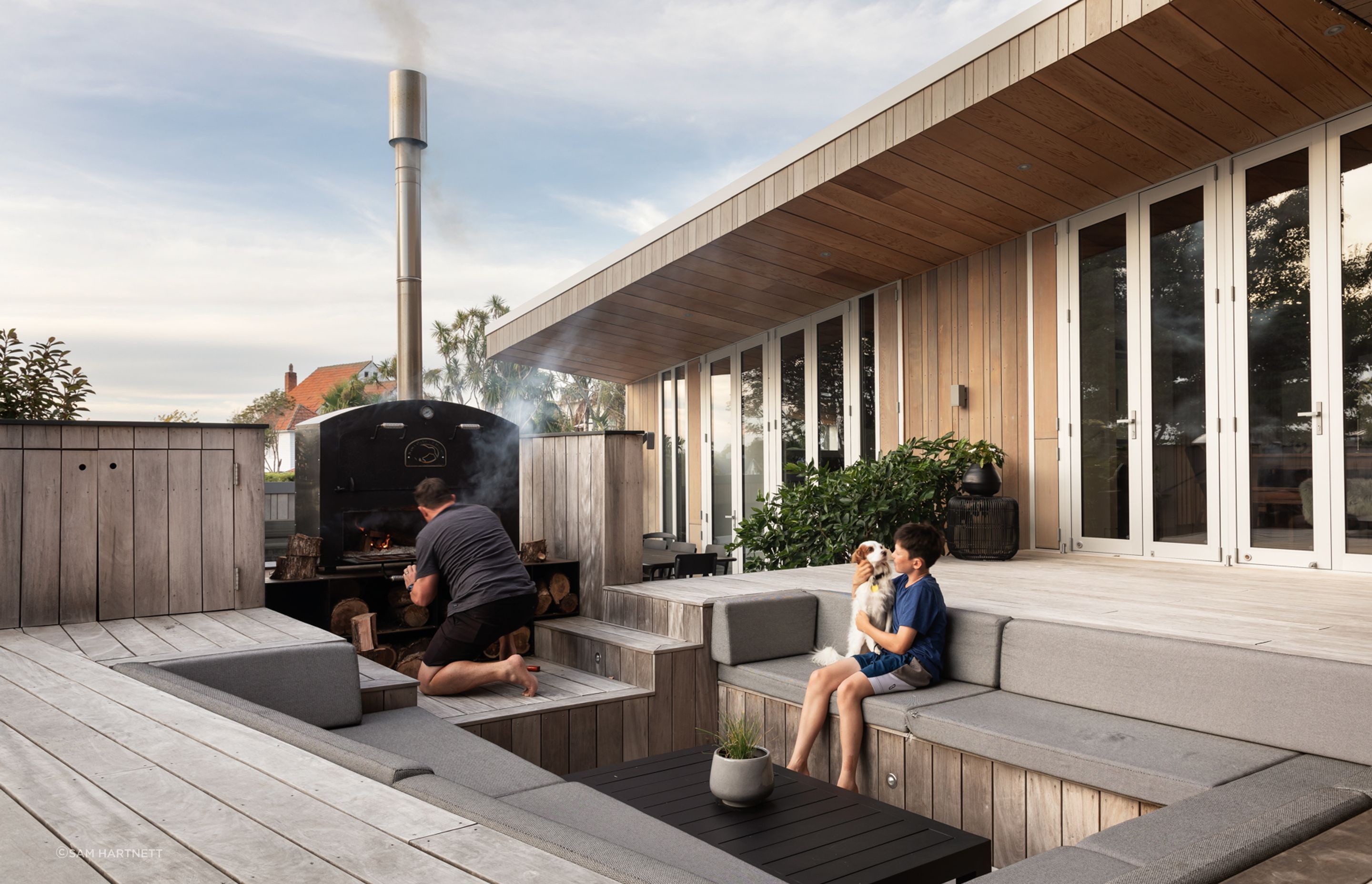 The sunken outdoor setting was designed to place people at eye level to the outdoor fire; creating a greater sense of intimacy than if they were sitting at a table.