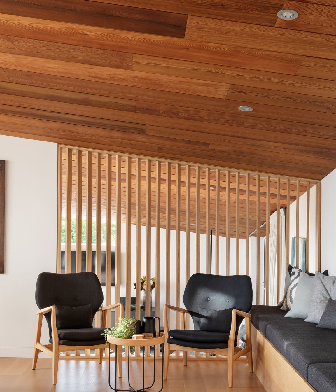 Simple structural forms are elegantly positioned over tiered spatial arrangements cascading down the sloping site, pulling light into the home while also offering moments of retreat.
