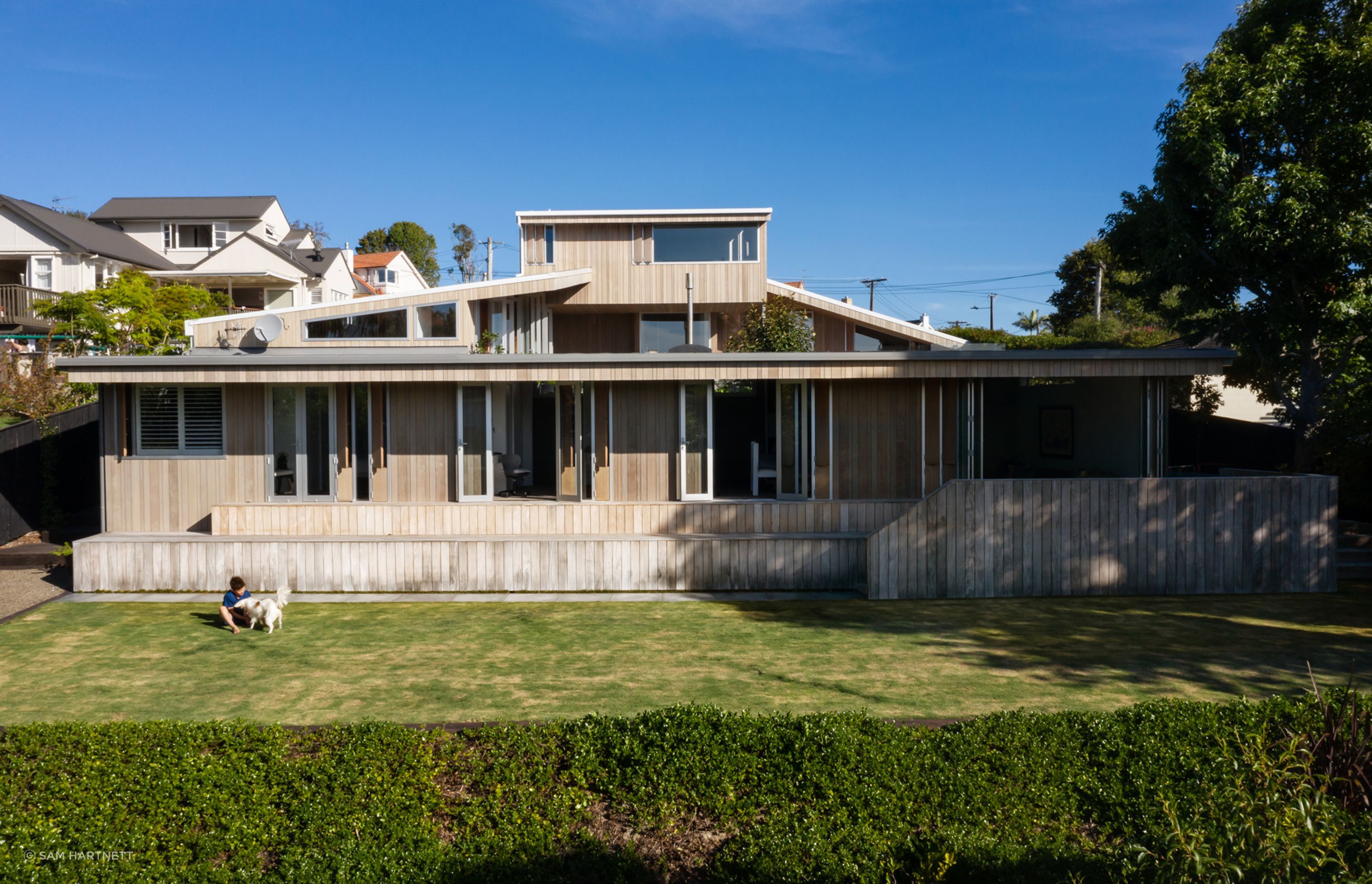 With the house stretching the full width of the site, stepping the plan down the gradient and lowering roof planes, meant the design was able to take advantage of as much of the northern light as possible.