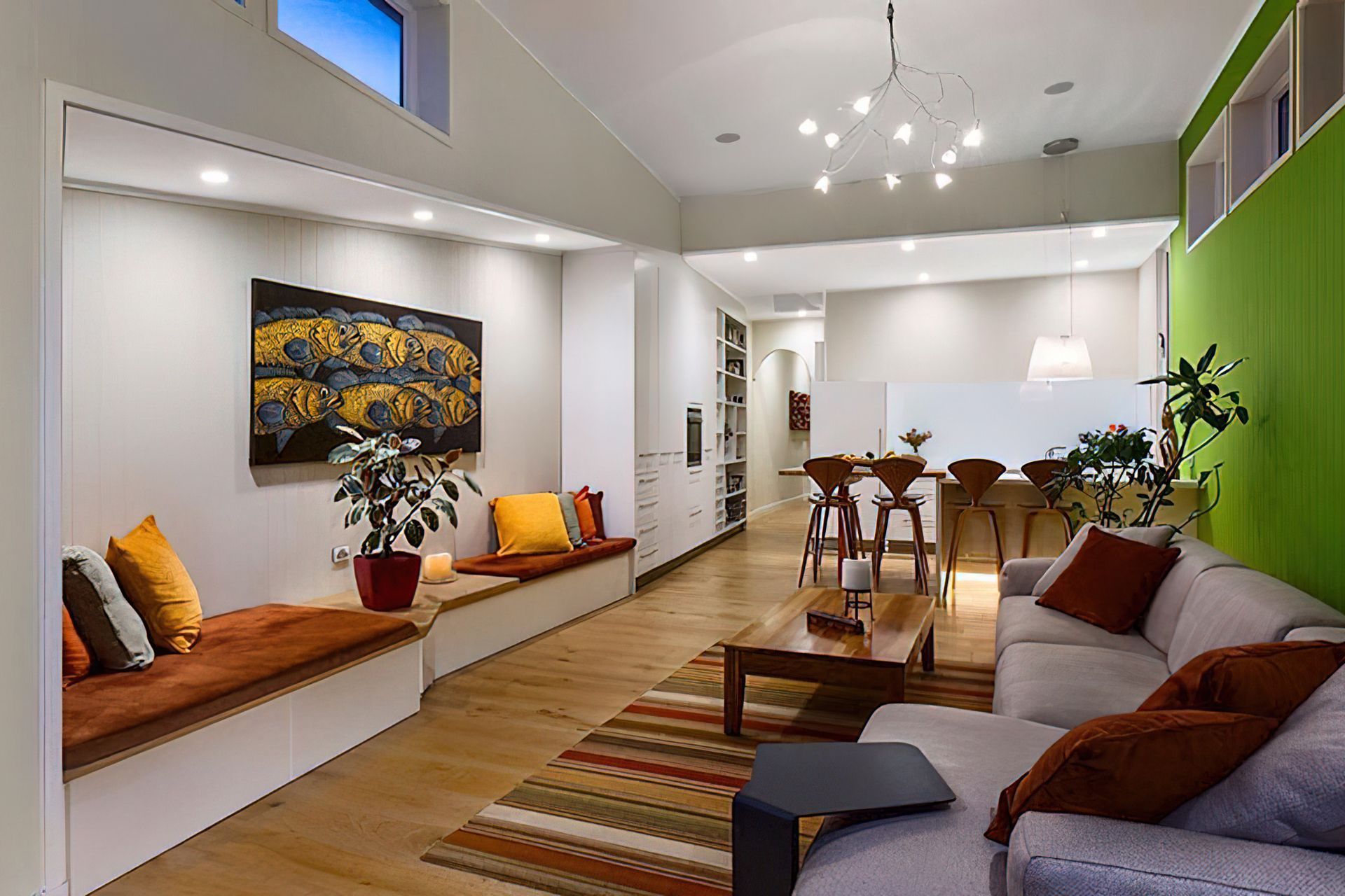 A once dark jumble of spaces and low ceilings, is now full of light. By leaving the original roof profile to the boundary we didn't have to agree with the neighbour on extending the parti-wall