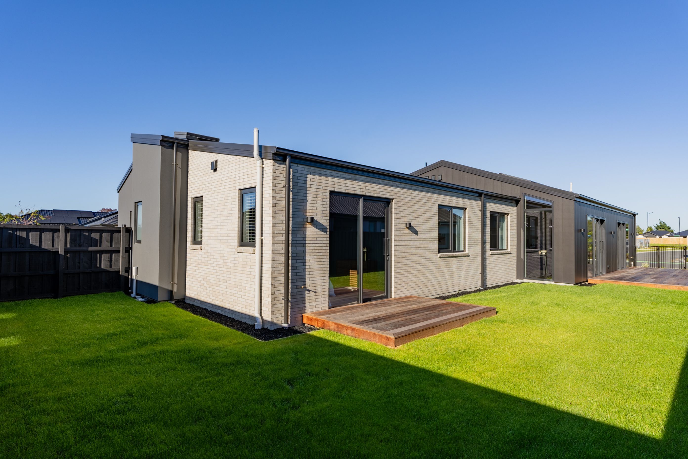 Exterior of the Home Showcasing Three Types of Cladding