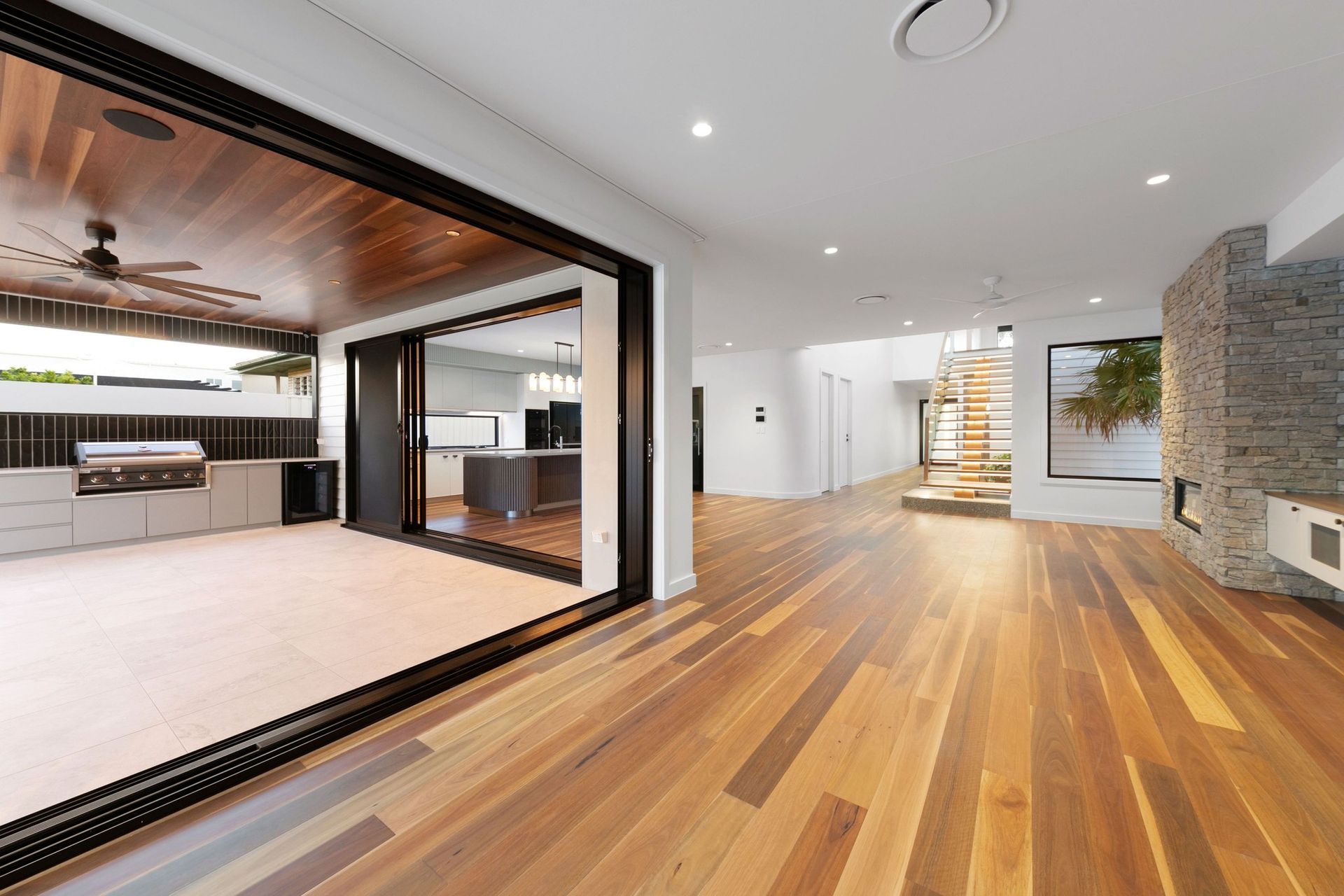Big sliders dissolve the wall between lounge and alfresco — one long entertaining space.