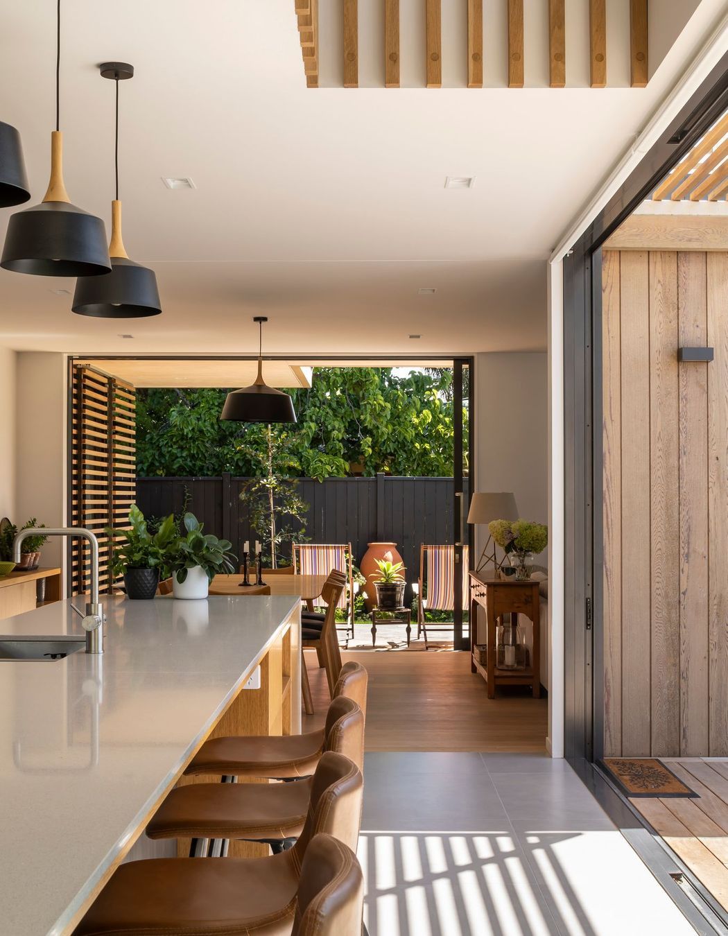 The open nature of the plan allows for a high level of cross-ventilation, while the void space above the kitchen encourages natural, stack-type ventilation.