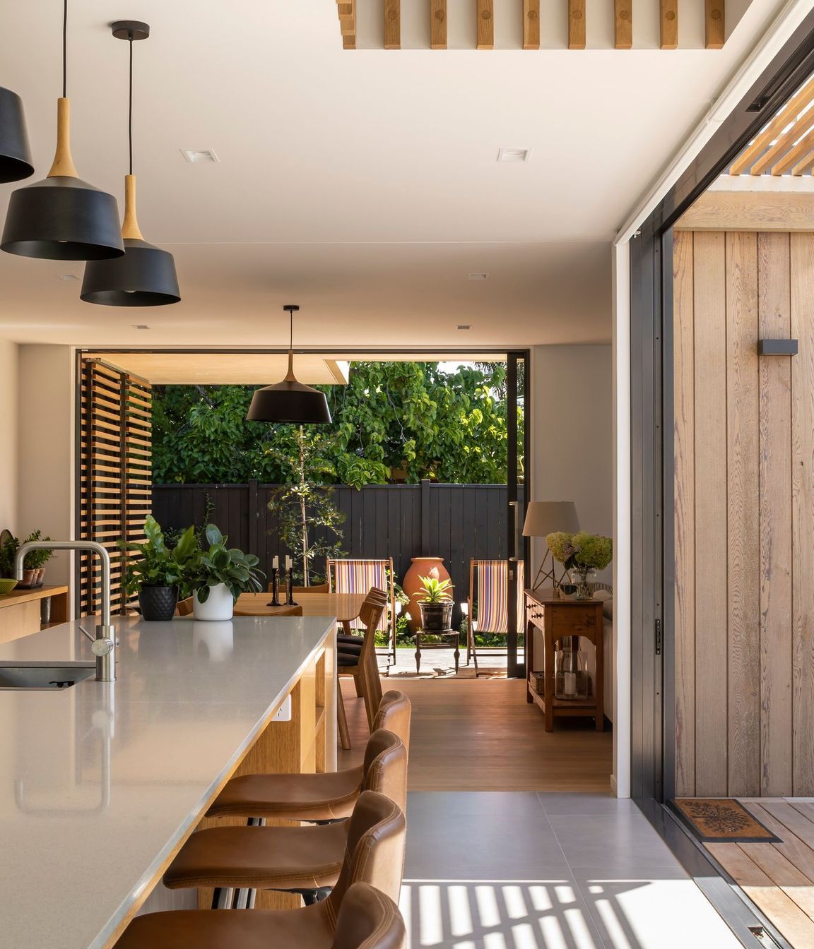 The open nature of the plan allows for a high level of cross-ventilation, while the void space above the kitchen encourages natural, stack-type ventilation.