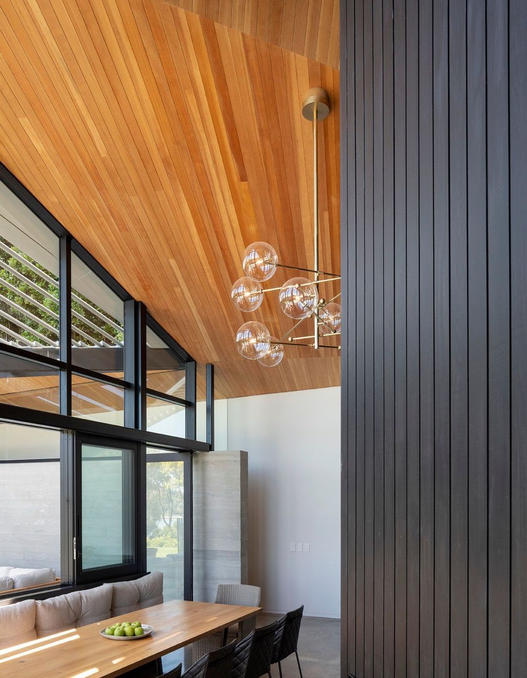 The ceiling plane lowers over the main dining space to feel relatively intimate next to the soaring volume over the mezzanine.