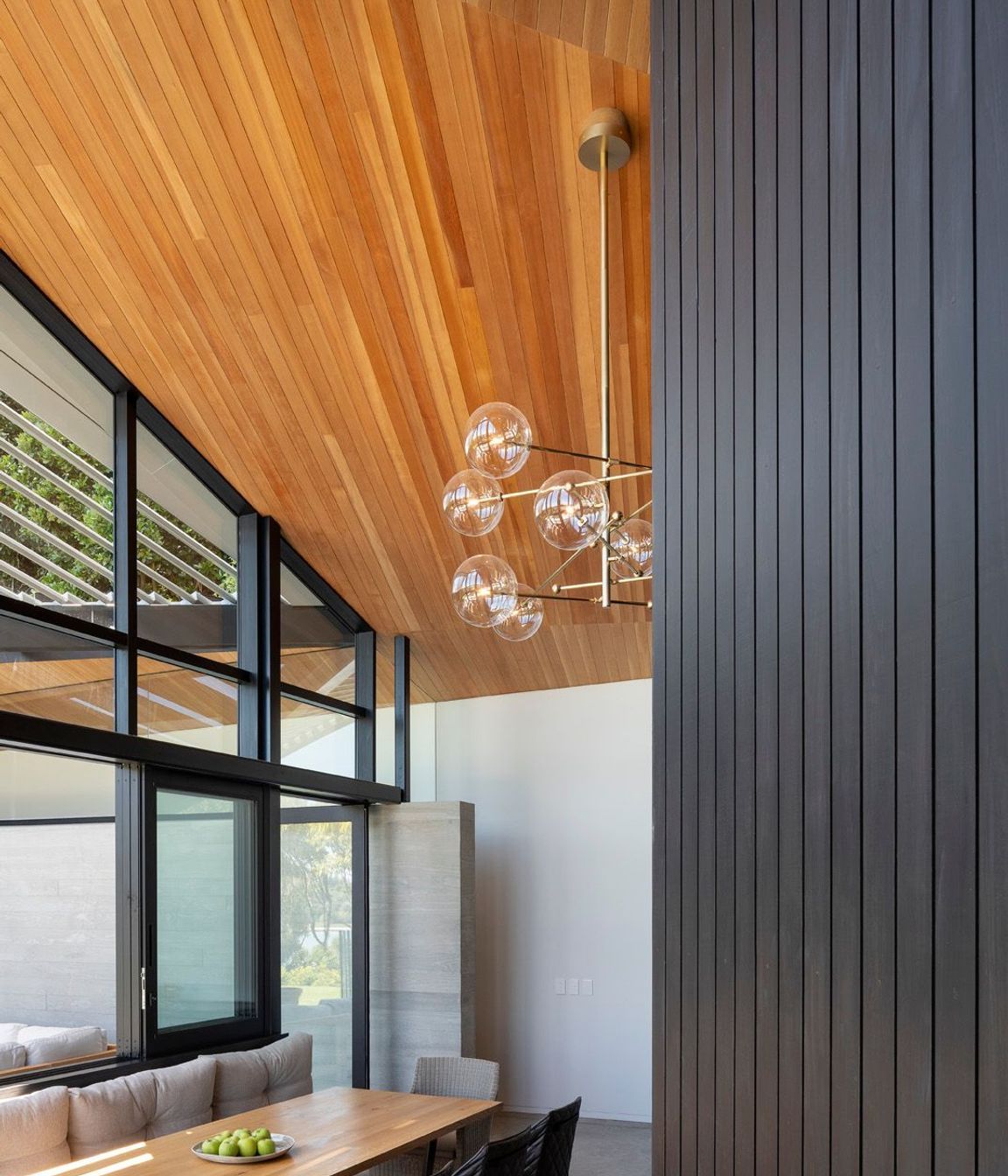 The ceiling plane lowers over the main dining space to feel relatively intimate next to the soaring volume over the mezzanine.